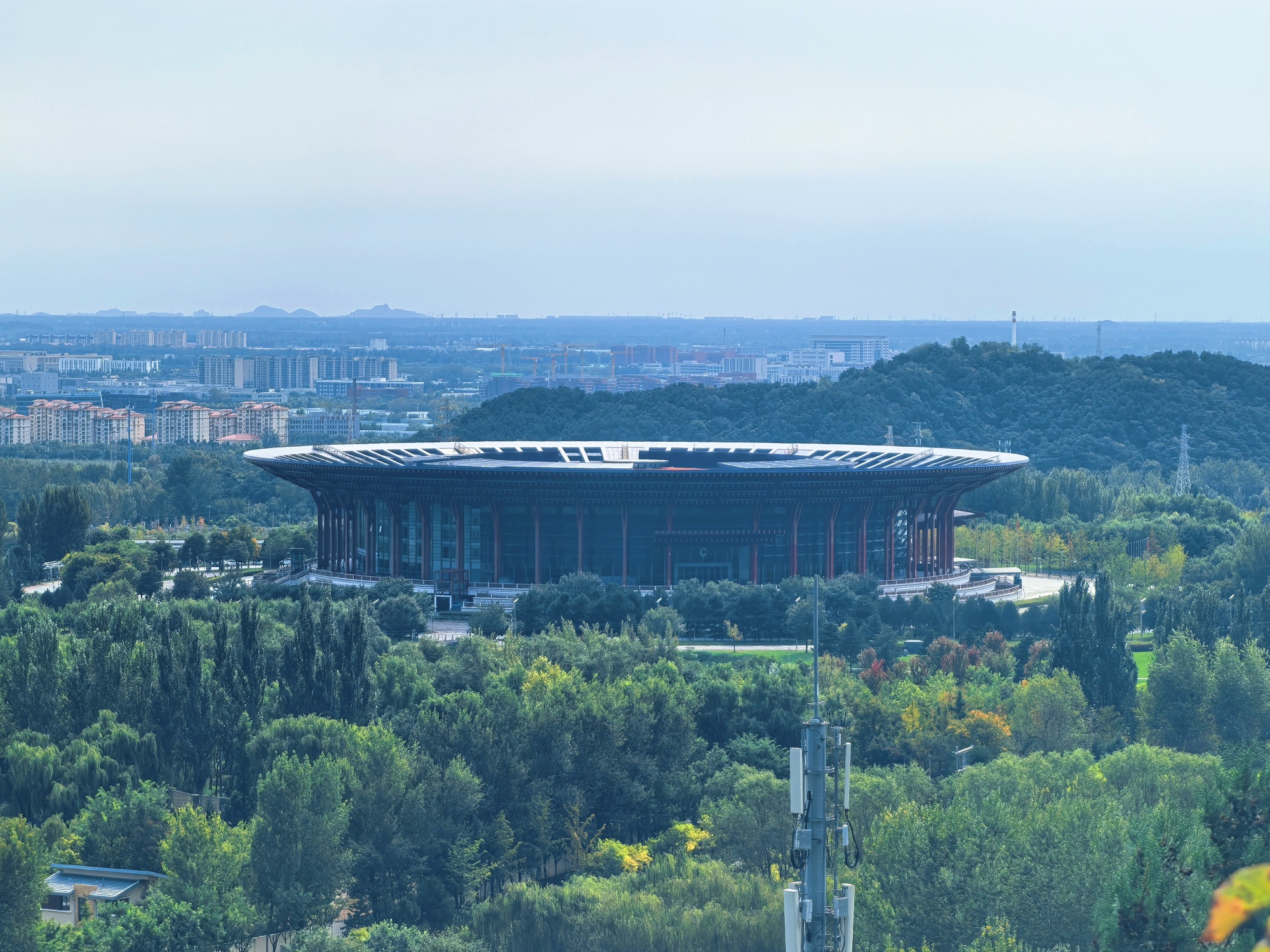 The Yanqi Lake International Convention and Exhibition Center is seen from the Yanqi Lake West Mountain Trail in Beijing, on October 6, 2025. /CGTN