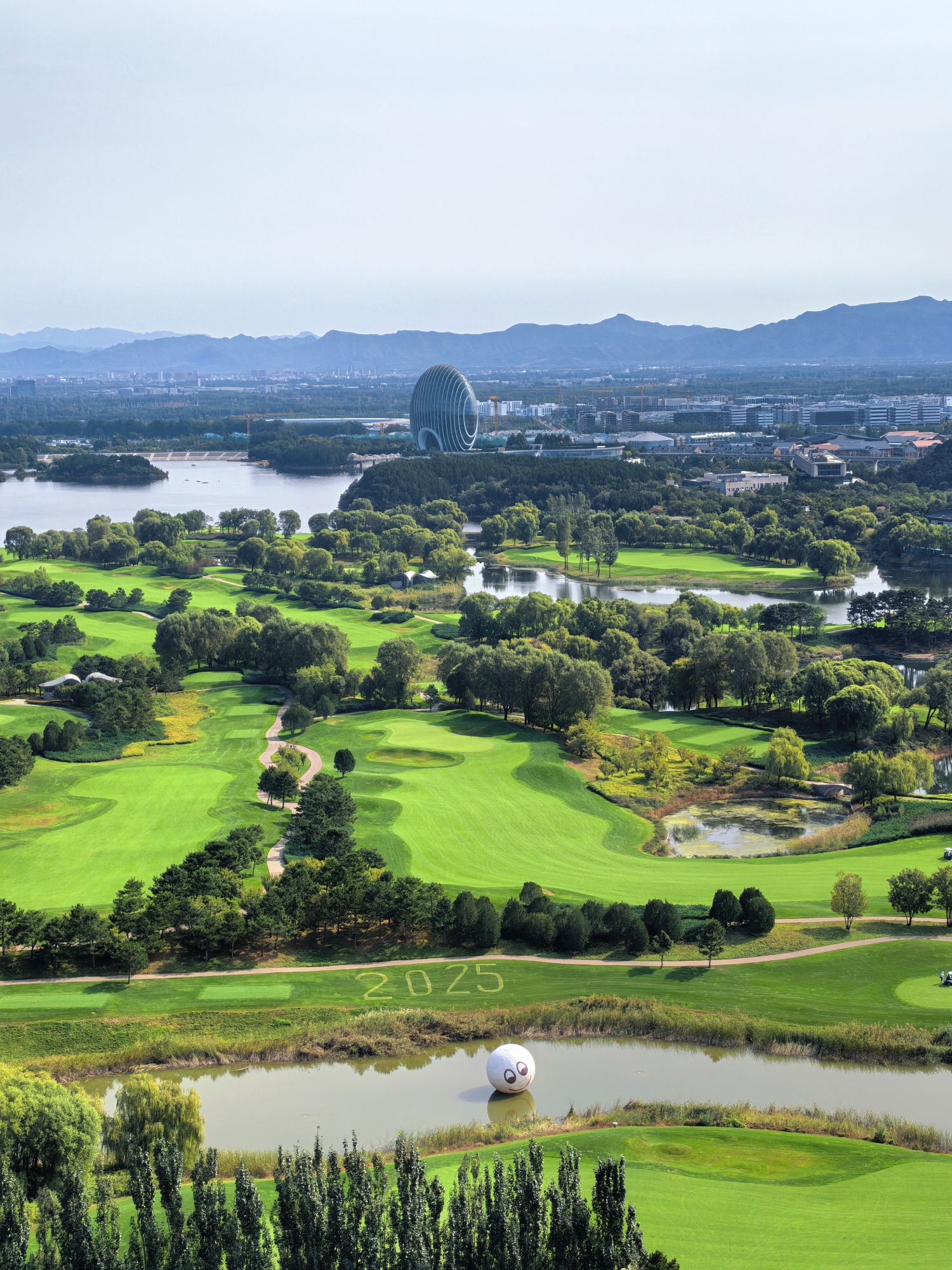 Iconic landmark Sunrise Kempinski Hotel is seen from the Yanqi Lake West Mountain Trail in Beijing, on October 6, 2025. /CGTN