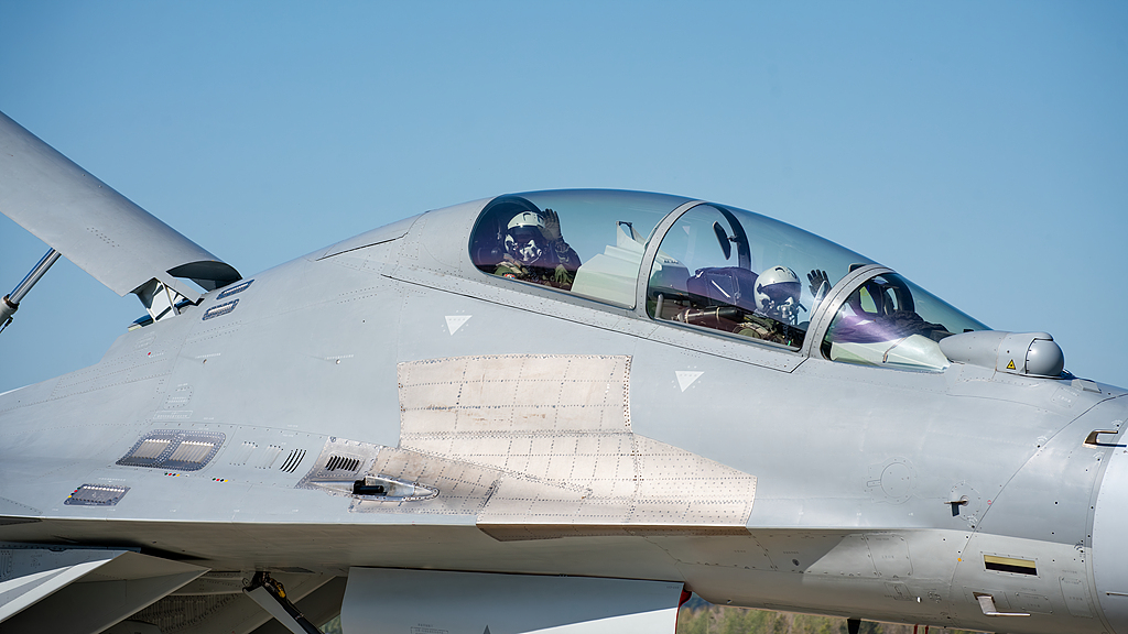Pilots of a J-16 fighter jet wave to the audiences at the Changchun Air Show in Changchun, northeast China's Jilin Province, September 23, 2025. /VCG
