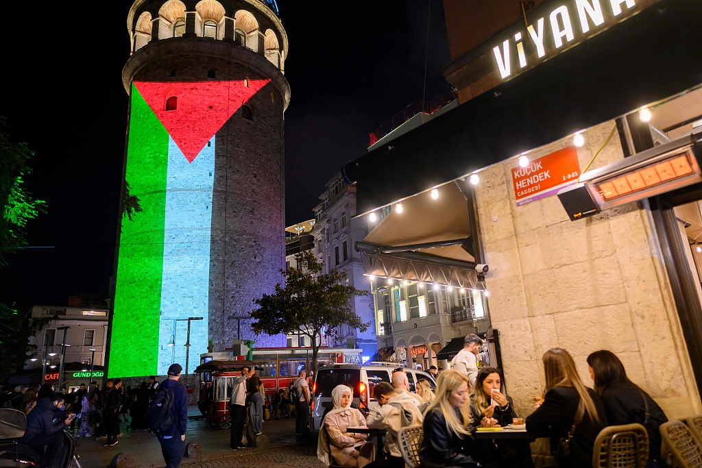 The Galata Tower illuminates with the Palestinian flag in the background to mark the second anniversary of the Gaza conflict in Turkish city of Istanbul, October 7, 2025. /VCG