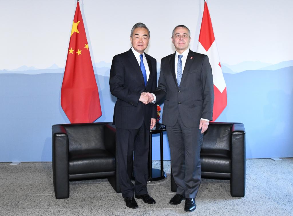 Chinese Foreign Minister Wang Yi, also a member of the Political Bureau of the Communist Party of China Central Committee, shakes hands with Swiss Federal Councillor and Foreign Minister Ignazio Cassis in Bellinzona, Switzerland, October 10, 2025. /Xinhua