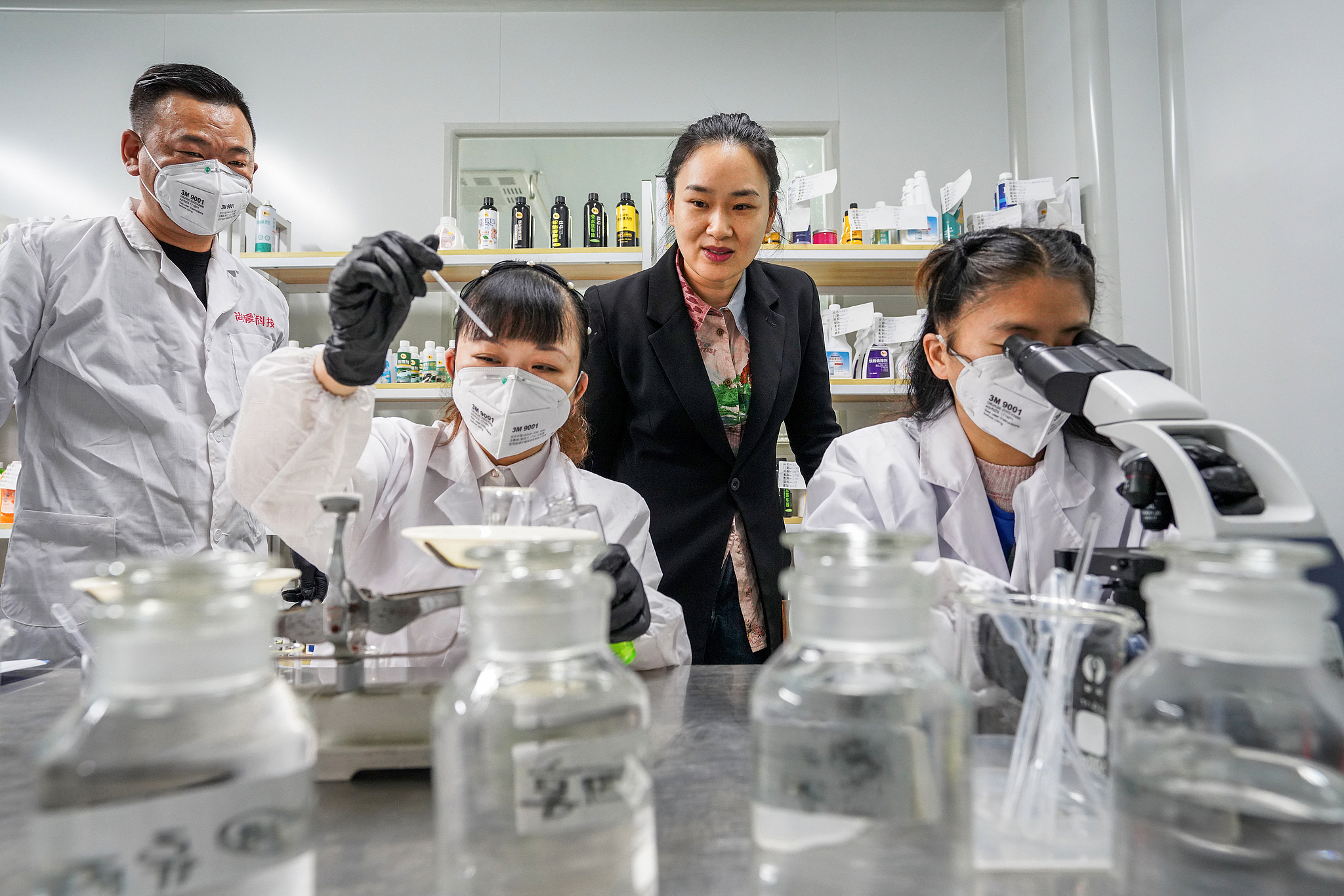 Workers at a factory in Wuhan, Hubei Province in central China, produce cleaning products to be sold on e-commerce platforms, April 21, 2023. /CFP