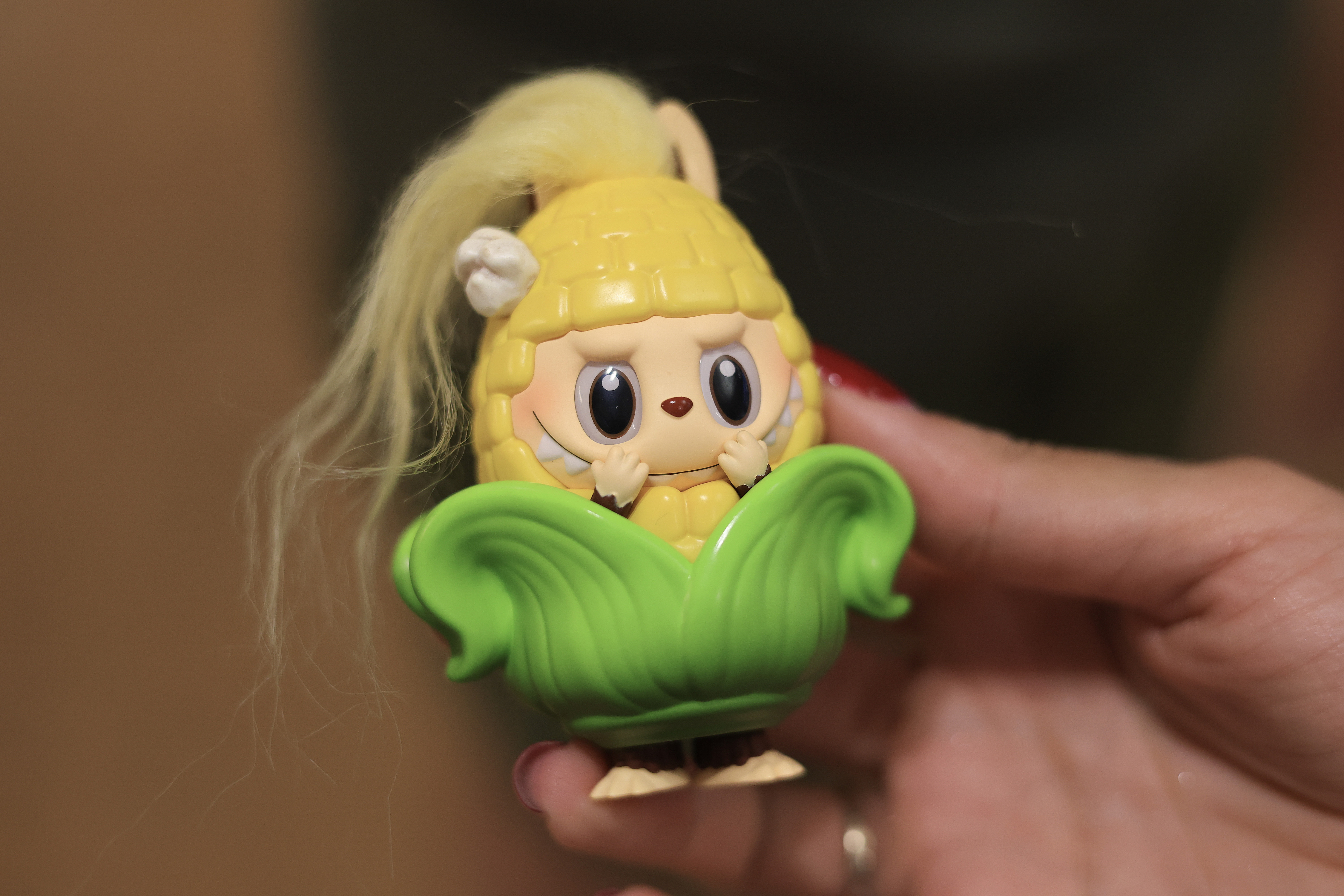 A Labubu series collectible toy is displayed after being purchased at the Pop Mart Robo Shop, U.S., September 9, 2025. /VCG