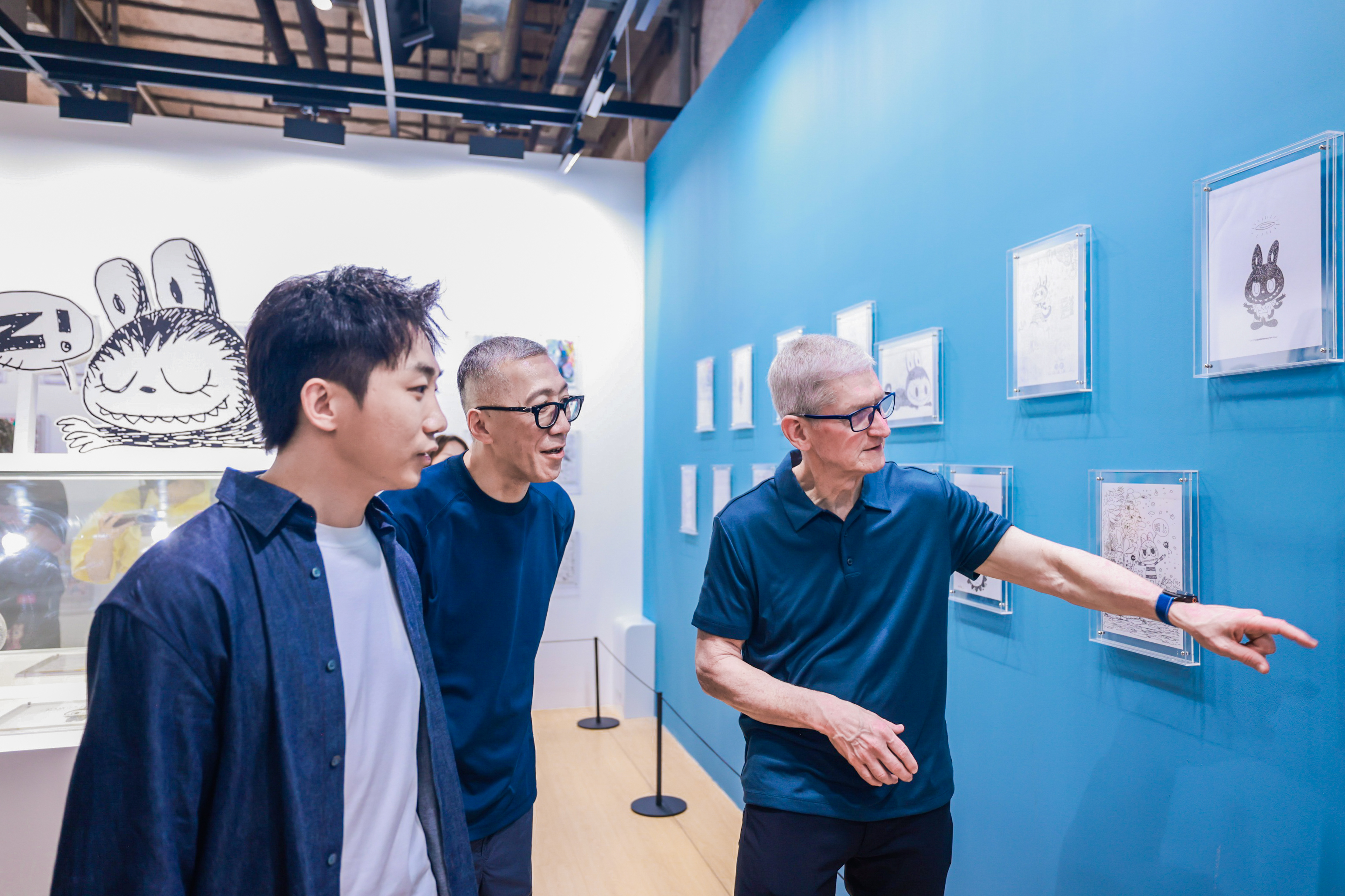 Tim Cook tours the Labubu exhibition with founder Wang Ning and artist Kasing Lung, Shanghai, China, October 13, 2025. /provided to CGTN by Pop Mart