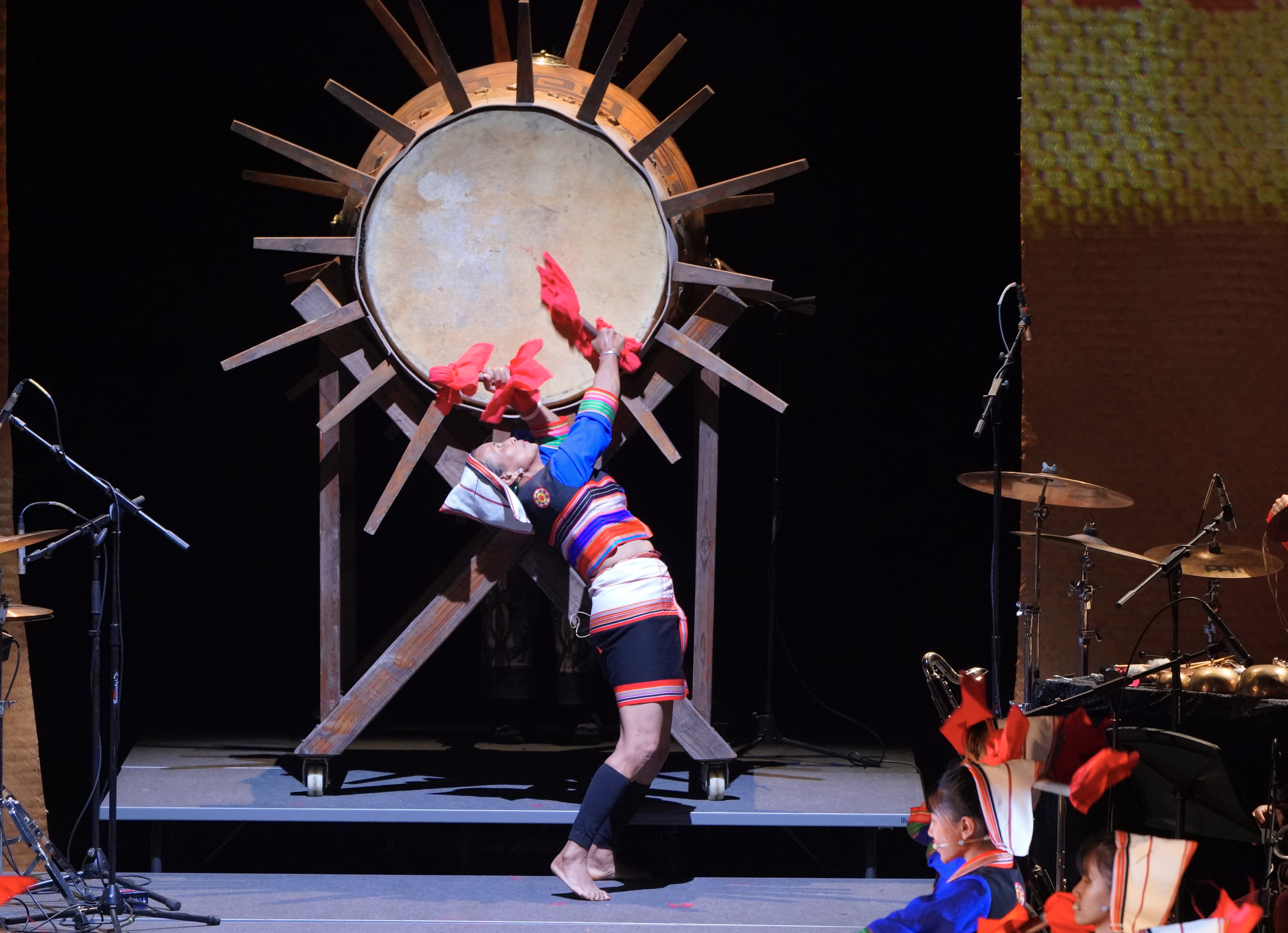 A drummer performs at the premiere of the Jino ethnic theater show, 