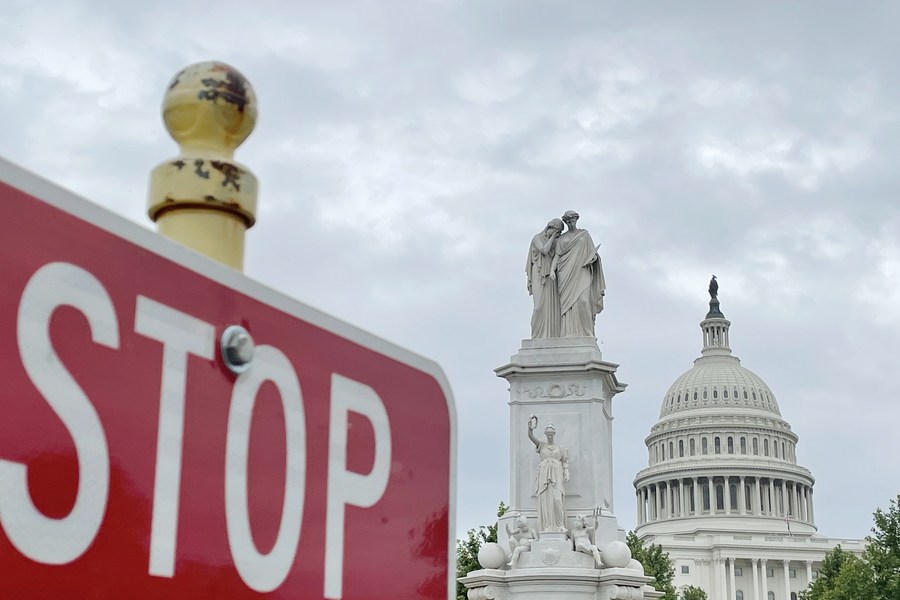 The U.S. Capitol building behind a traffic sign in Washington, D.C., the United States, May 28, 2021. /Xinhua