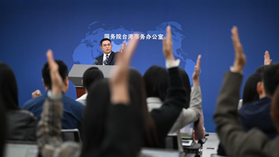 Chen Binhua, a spokesperson for the Taiwan Affairs Office of the State Council, gestures at a press conference in Beijing, China. /VCG