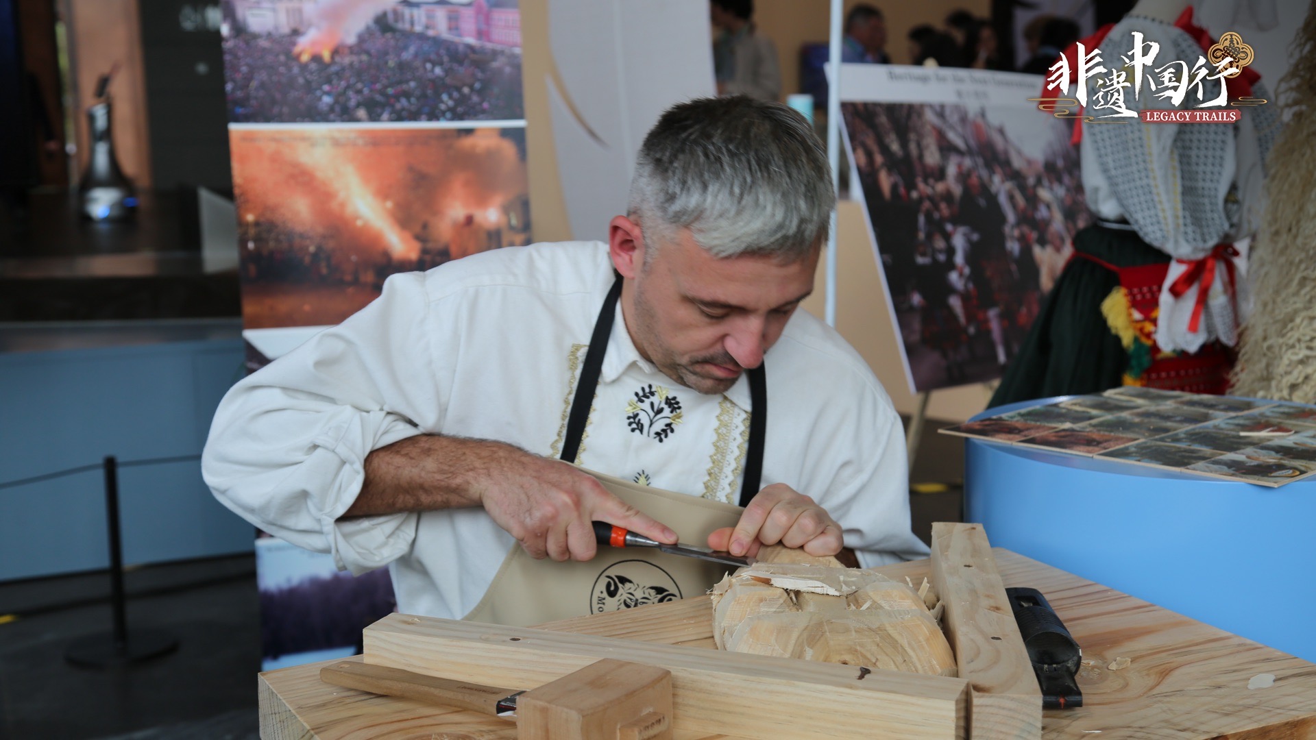 A practitioner from Hungary demonstrating his skill in carving at the International Intangible Cultural Heritage Exhibition at the Beijing Grand Canal Museum, Beijing, China, October 17, 2025. /CGTN