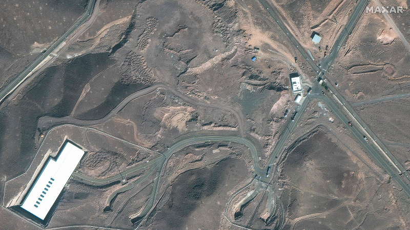 This handout satellite image, courtesy of Maxar Technologies, shows cargo trucks near an underground entrance to Iran's Fordow Fuel Enrichment Plant in Fordo, Iran, June 20, 2025. /VCG