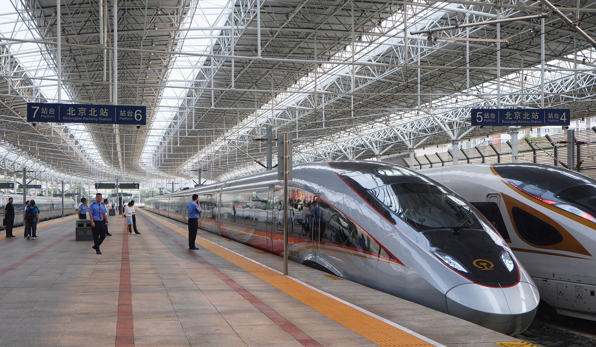 Two of China's high speed trains await departure at the North Beijing Railway Station, Beijing, October 11, 2025. /VCG
