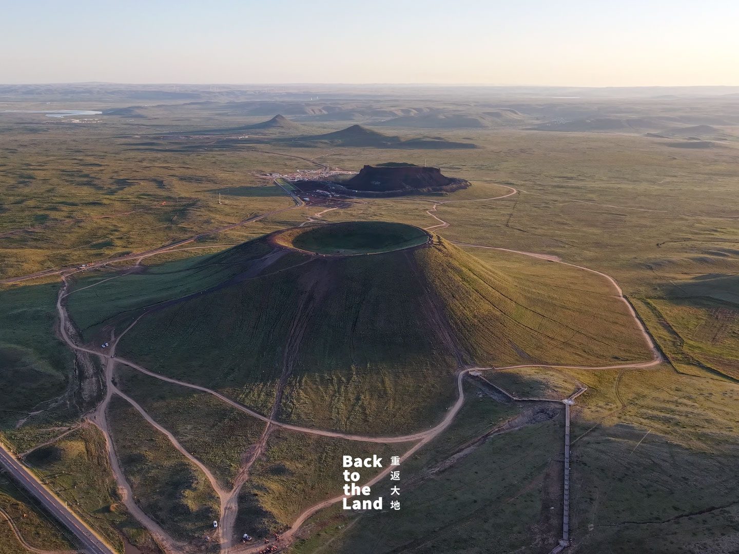 Lava plateaus and cones rise out from the expansive grasslands of Ulanqab, Inner Mongolia Autonomous Region. /CGTN