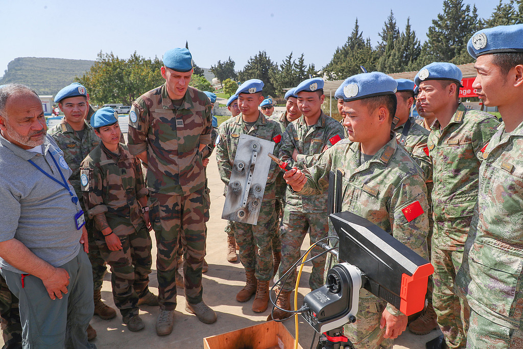 The 22nd Chinese peacekeeping multifunctional engineering detachment held an exchange with the French battalion on mine clearance and explosive ordnance disposal operations in Lebanon, April 4, 2024. /CFP