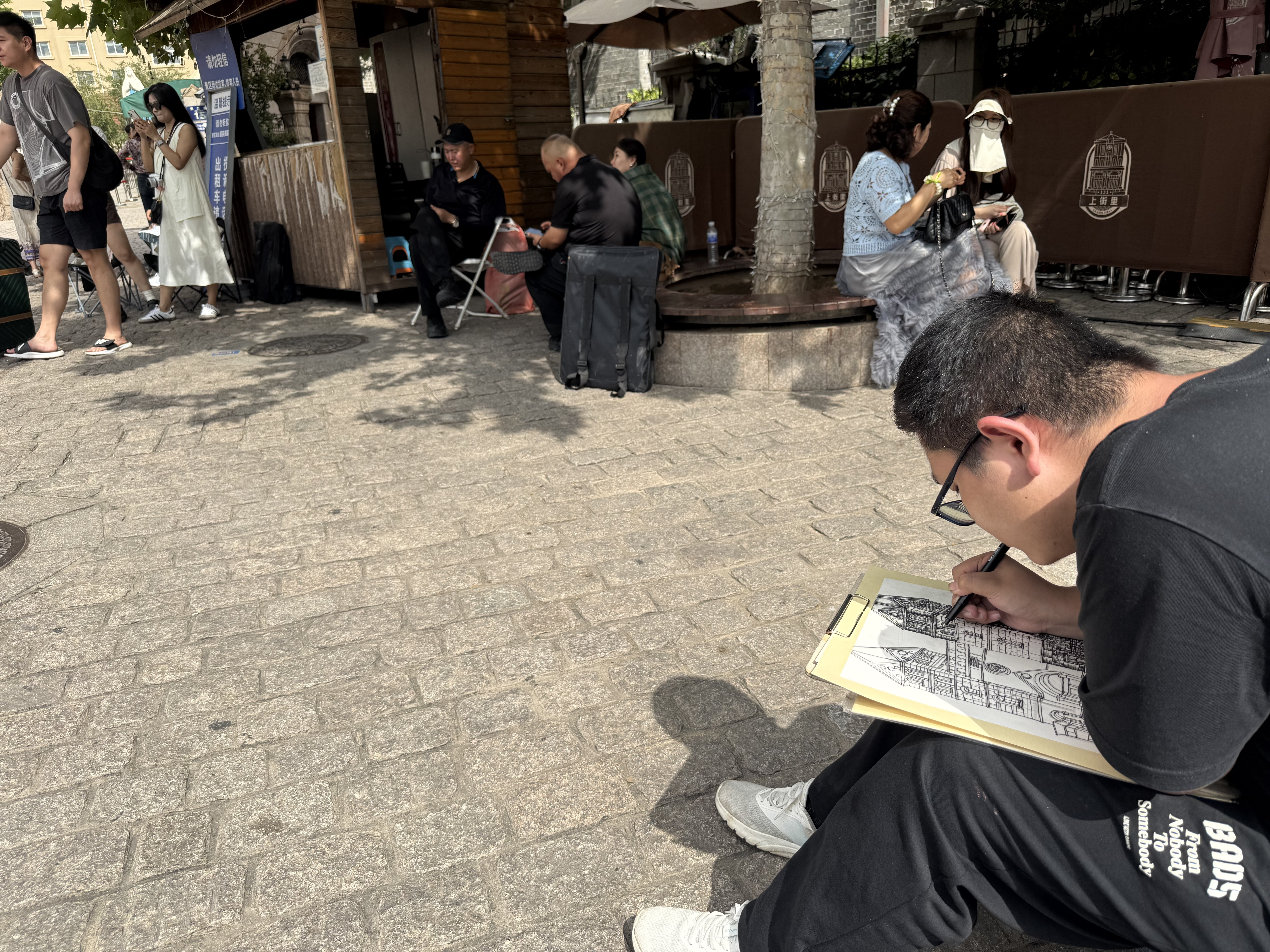 A street artist sketches St. Michael's Cathedral in Qingdao, Shandong Province, China, September 2025. Zaruhi Poghosyan /CGTN