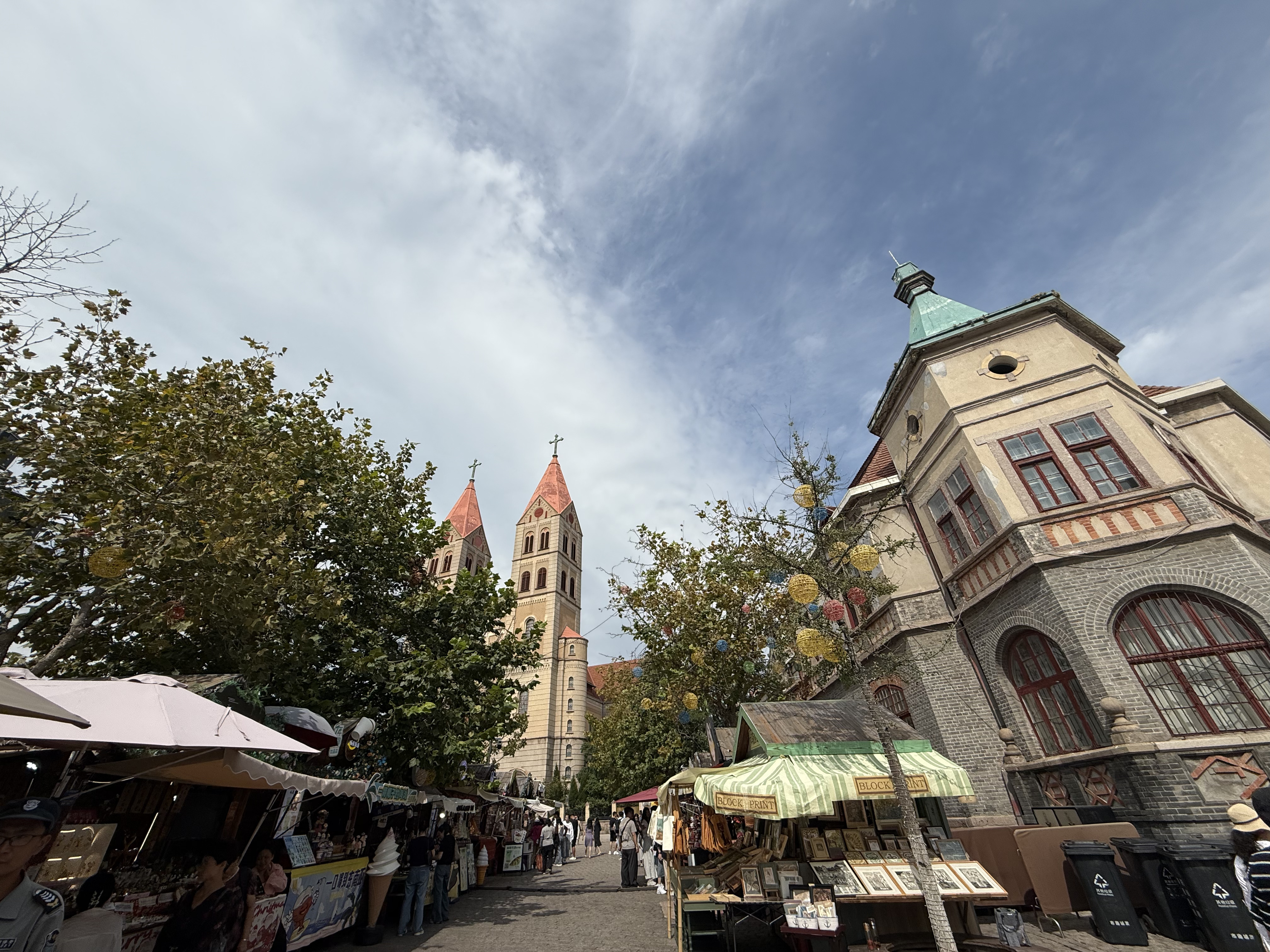 An open-air market, selling trinkets and art, near St. Michael's Cathedral in Qingdao, Shandong Province, China, September 2025. Zaruhi Poghosyan /CGTN