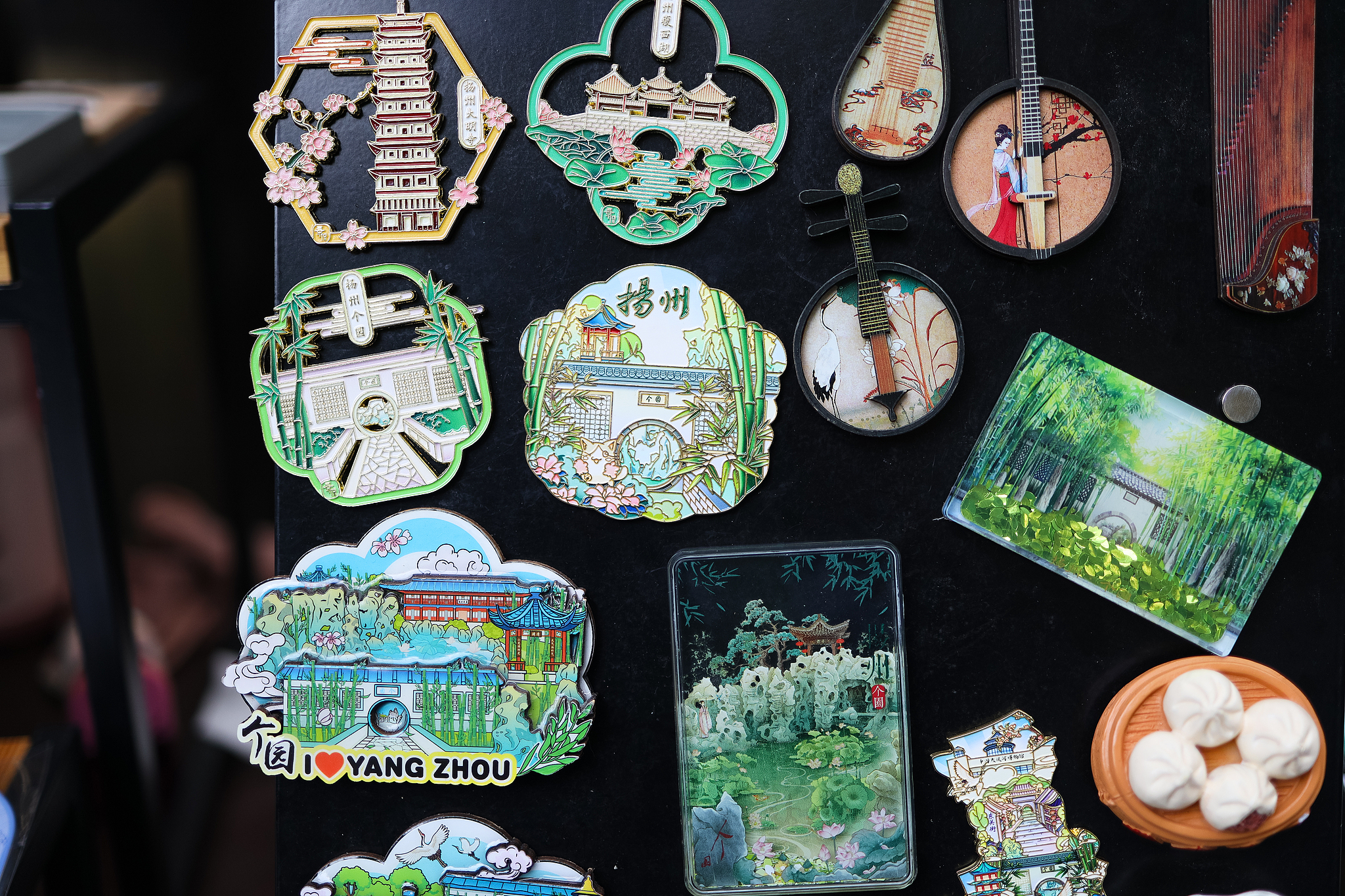 Various fridge magnets are seen on sale at a shop in Yangzhou's Geyuan Garden, Jiangsu Province. /VCG
