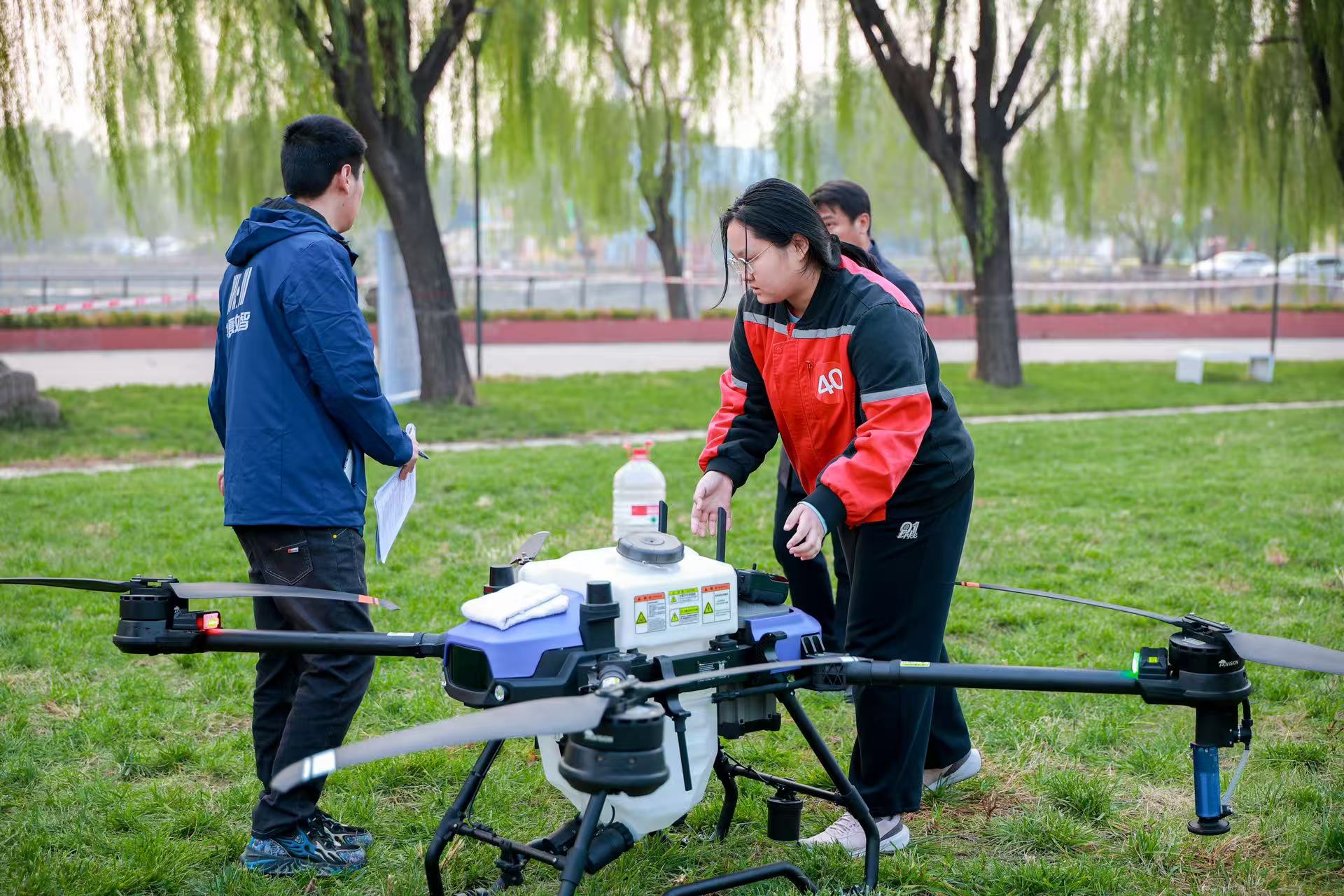 Young drone pilots compete in a contest set against the backdrop of a real-world farming environment as part of an initiative by Beijing's Chaoyang District to foster the 