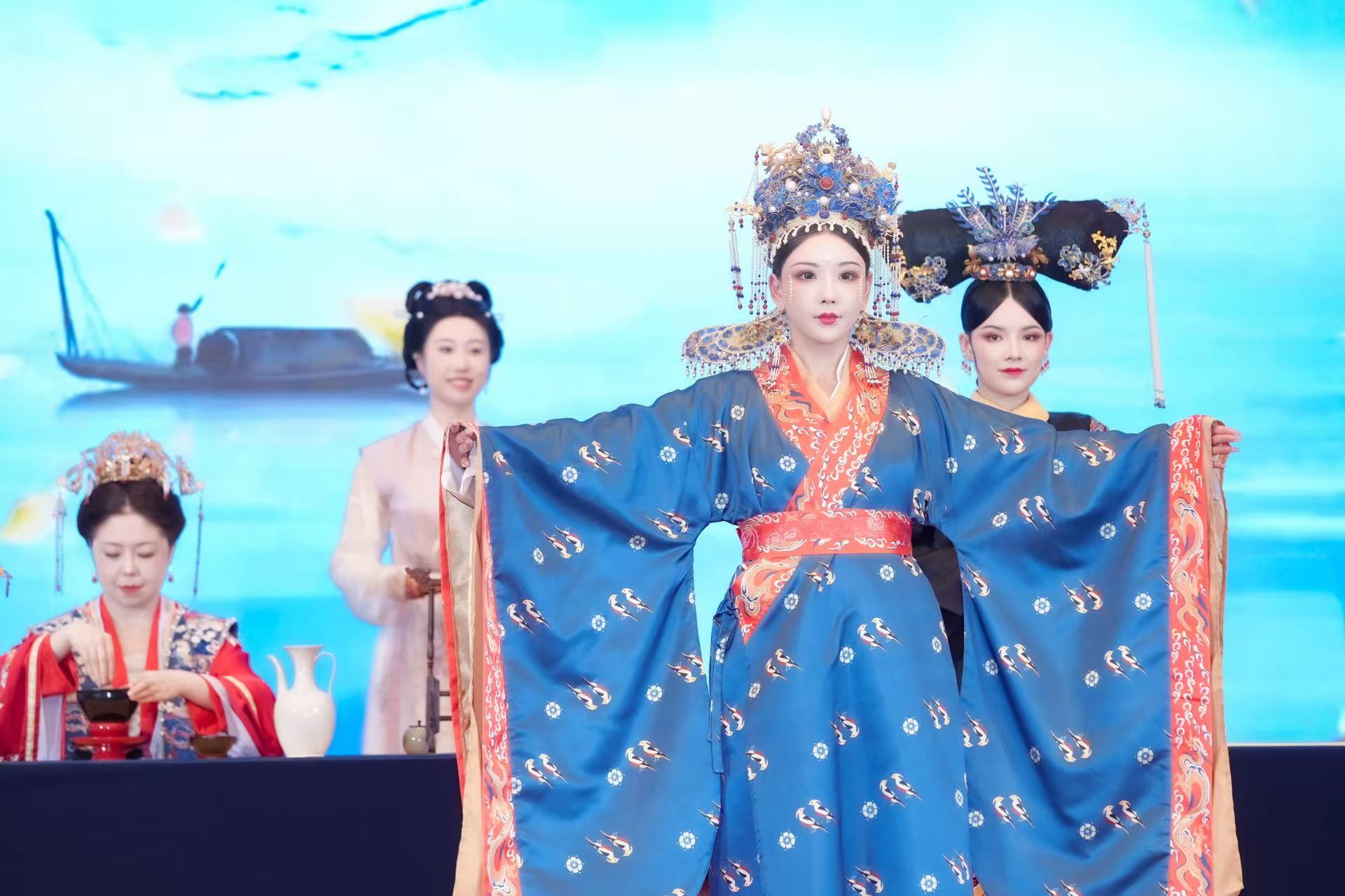 A tea art specialist and performers in ancient costumes captivate visitors at the 4th Vocational Training and Development Conference held on October 25, 2025 in Beijing's Chaoyang District. /Photo provided to CGTN