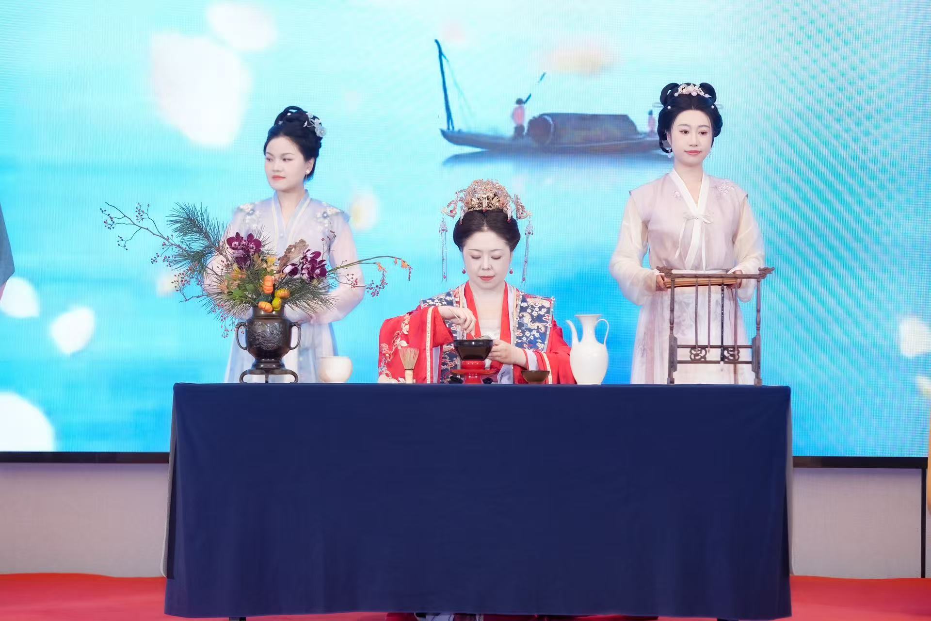 A tea art specialist and performers in ancient costumes captivate visitors at the 4th Vocational Training and Development Conference held on October 25, 2025 in Beijing's Chaoyang District. /Photo provided to CGTN