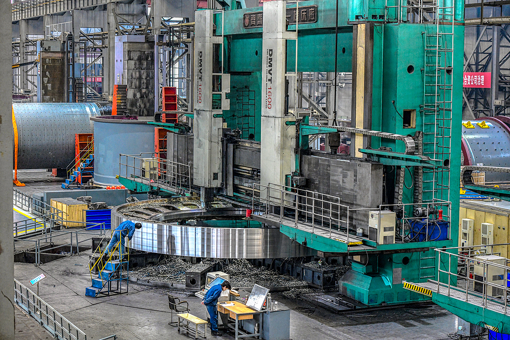 Workers are operating on the production line at Luoyang Bearing Group in a workshop dedicated to manufacturing bearings for wind turbine vehicles, Luoyang, Henan Province, March 14, 2024. /CFP