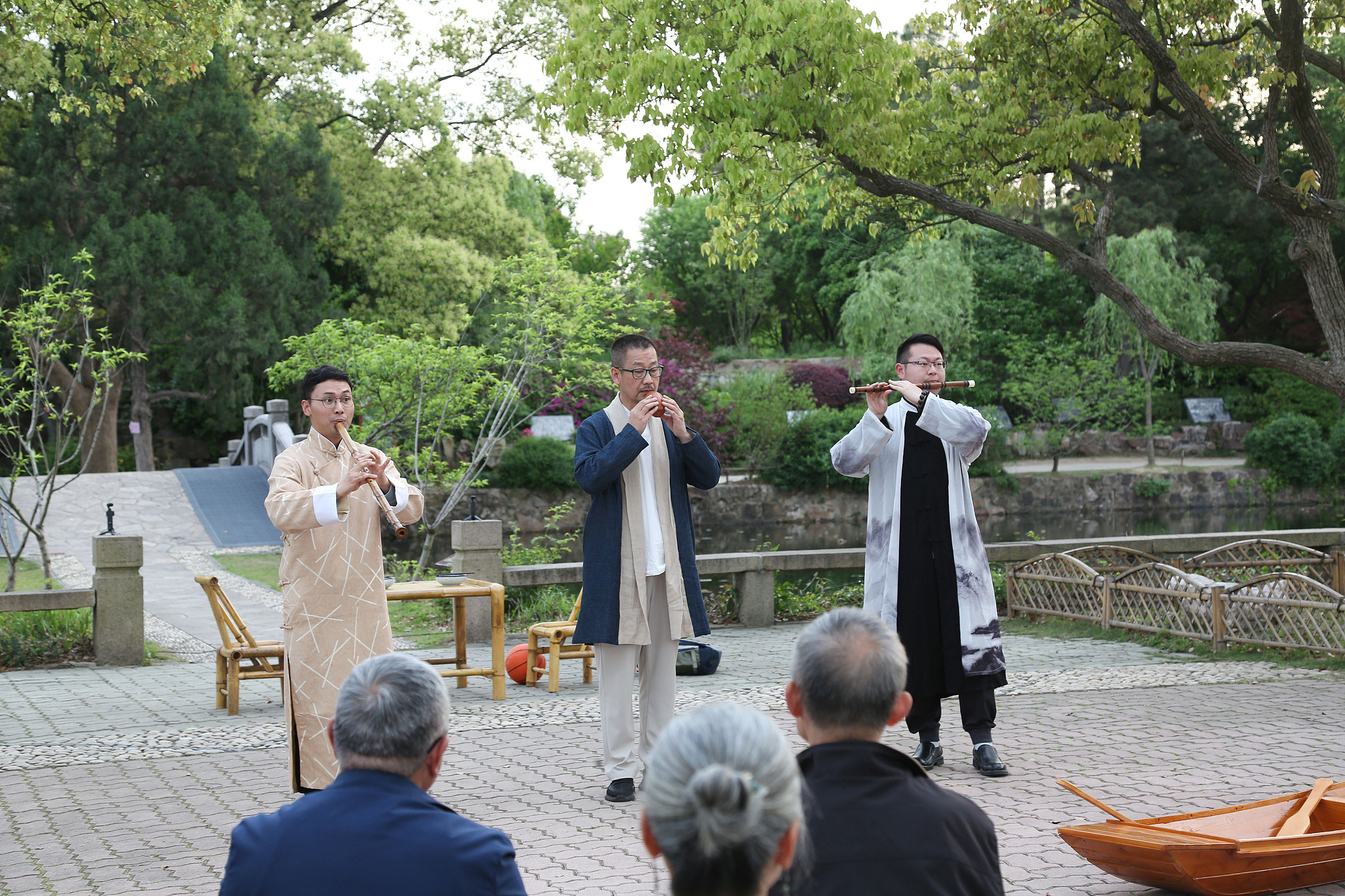 Performing artists play folk instruments in a park, Wuxi, Jiangsu, China, April 24, 2024. /CFP