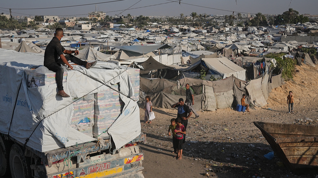 Trucks carrying aid drive through Khan Younis, southern Gaza, November 2, 2025. /VCG
