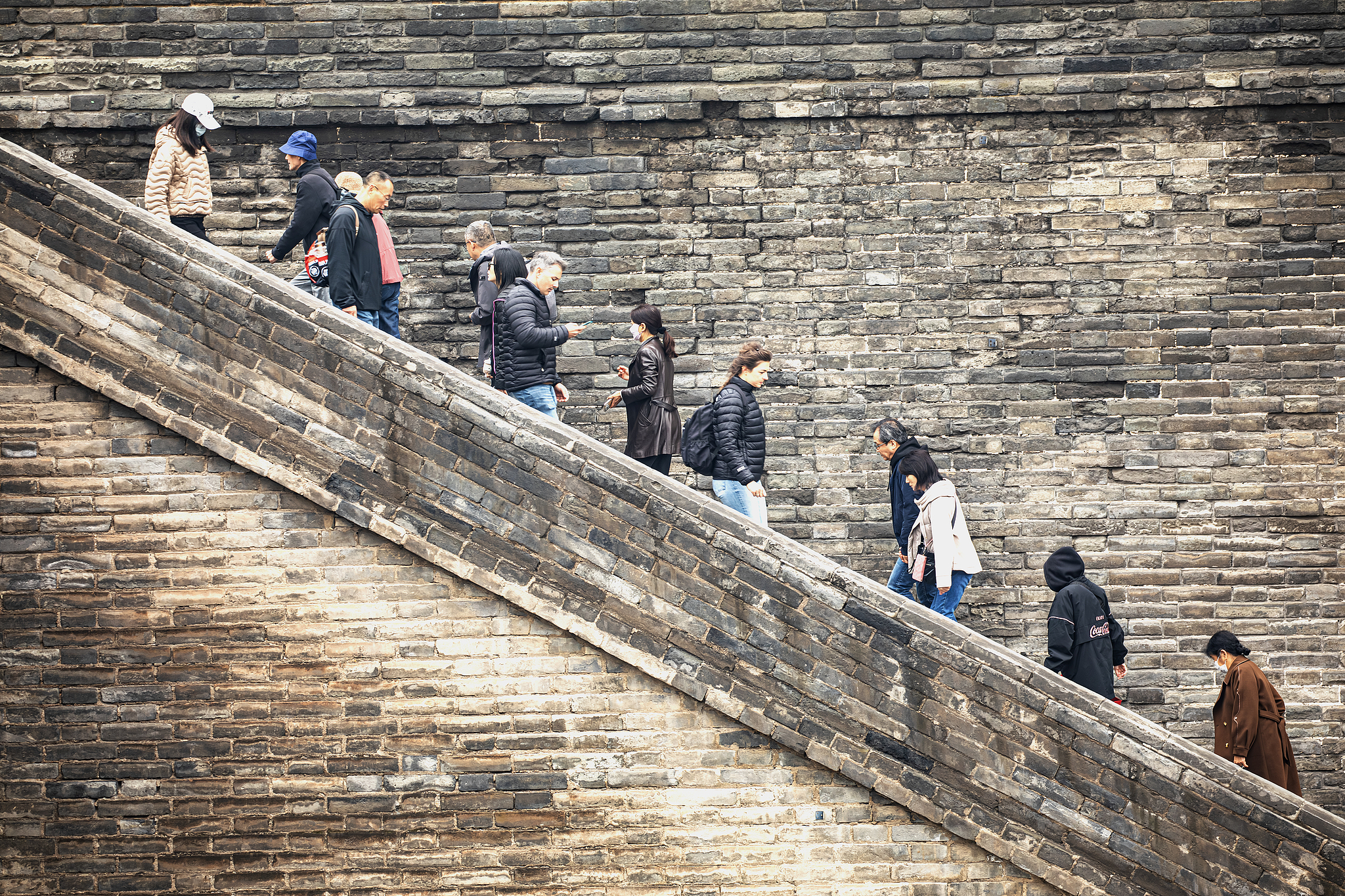 People visit the ancient wall in Xi'an, Shaanxi Province, on October 23, 2025. /VCG