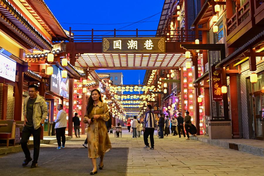 People visit a night market in Emin County, Tacheng Prefecture, northwest China's Xinjiang Uygur Autonomous Region, May 29, 2024./Xinhua