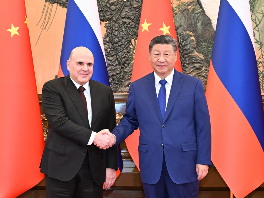 Chinese President Xi Jinping shakes hands with Russian Prime Minister Mikhail Mishustin at the Great Hall of the People in Beijing, China, November 4, 2025. /Xinhua