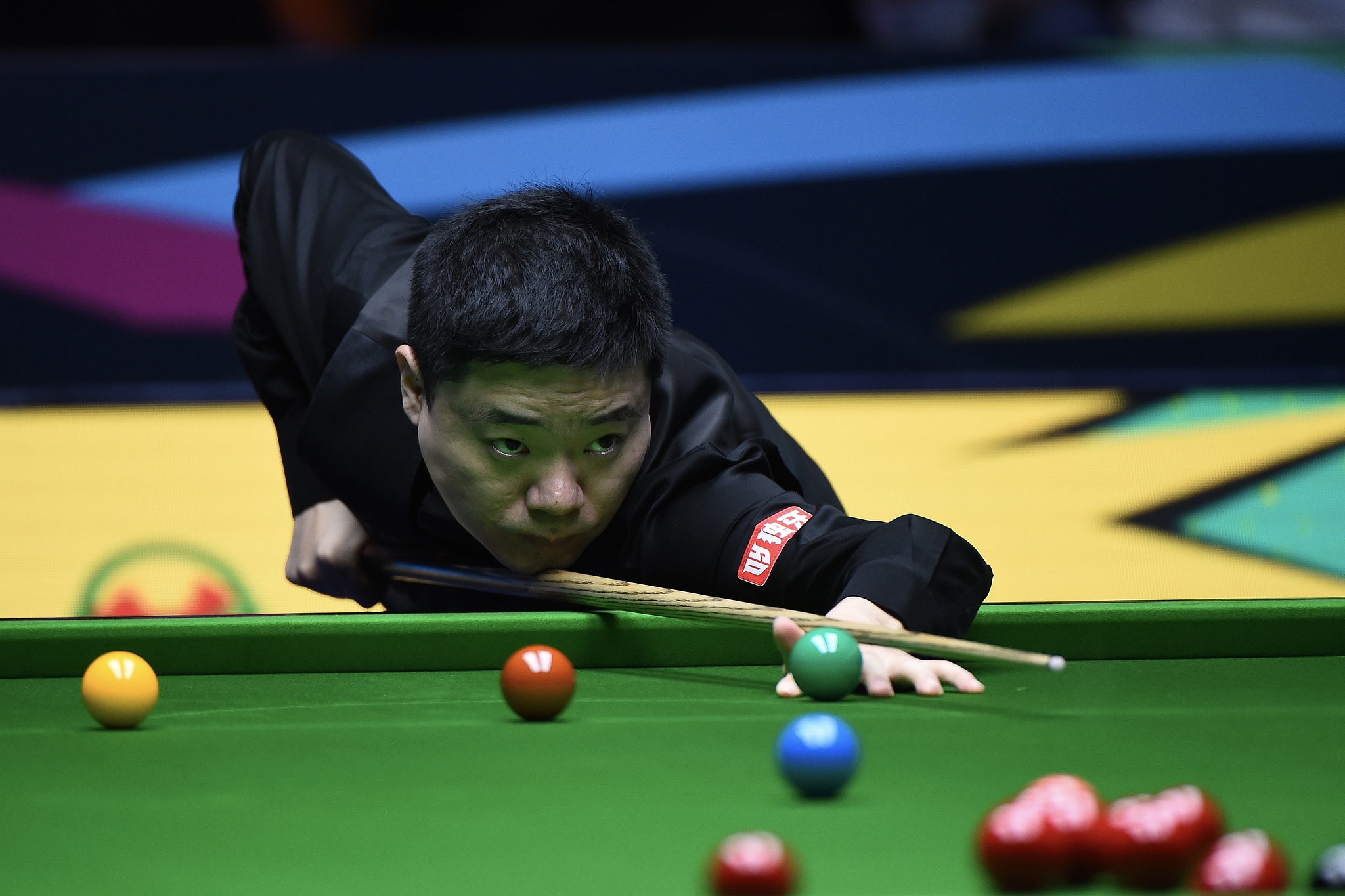 Ding Junhui of China hits a shot in the first-round match against Michael Holt of England at the World Snooker Tour (WST) International Championship in Nanjing, east China's Jiangsu Province, November 3, 2025. /VCG