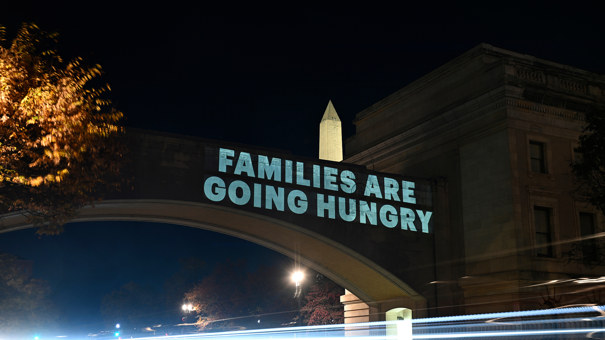 A message from the National Women's Law Center concerning the announcement by the Trump administration of restoring only half funding the SNAP benefits is projected on the U.S. Department of Agriculture building in Washington, D.C., November 3, 2025. /VCG