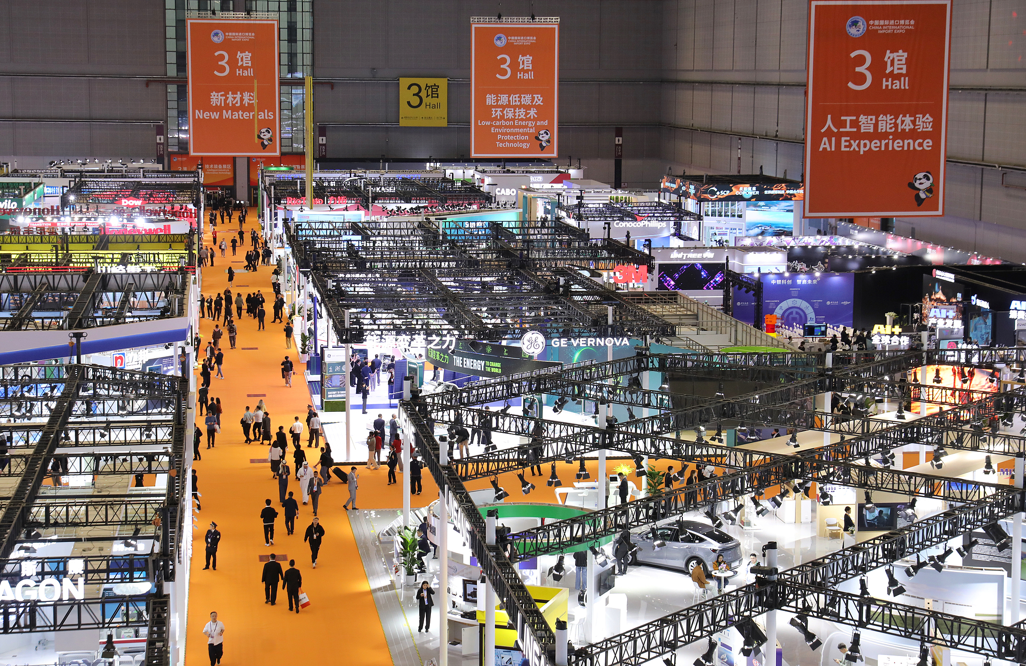 Visitors gather in the artificial intelligence section of the Equipment and Technology Pavilion on the opening day of the 8th China International Import Expo, Shanghai, China, November 5, 2025. /VCG