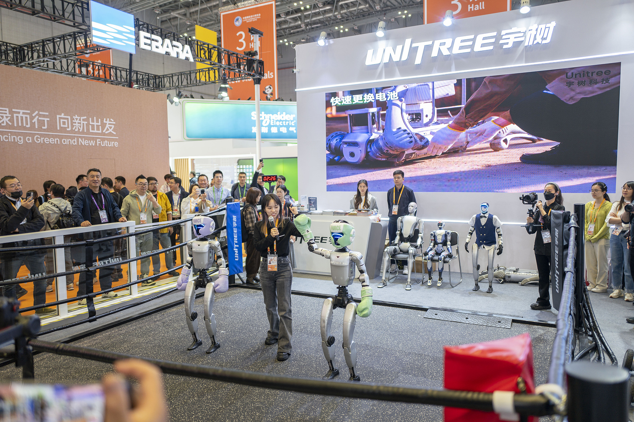 A robot combat competition at Unitree Robotics' pavilion in the technical equipment exhibition area during the 8th China International Import Expo in Shanghai, November 5, 2025./ VCG