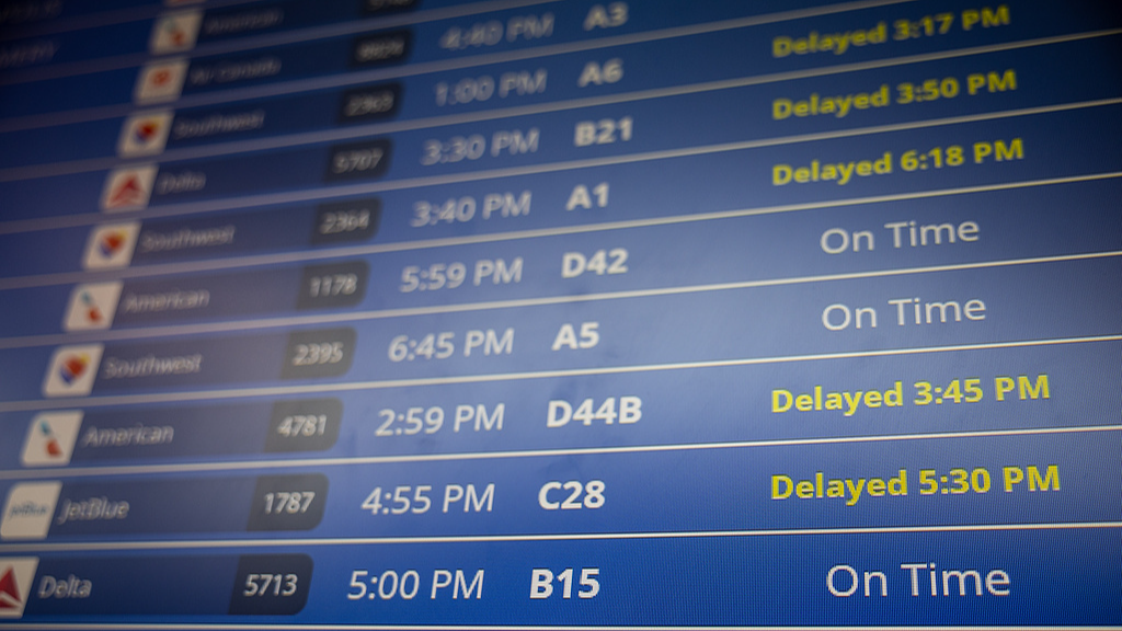A board provides information on delayed and on time flights at Ronald Reagan National Airport in Arlington, Virginia, U.S., on the 31st day of a government shutdown, October 31, 2025. /VCG