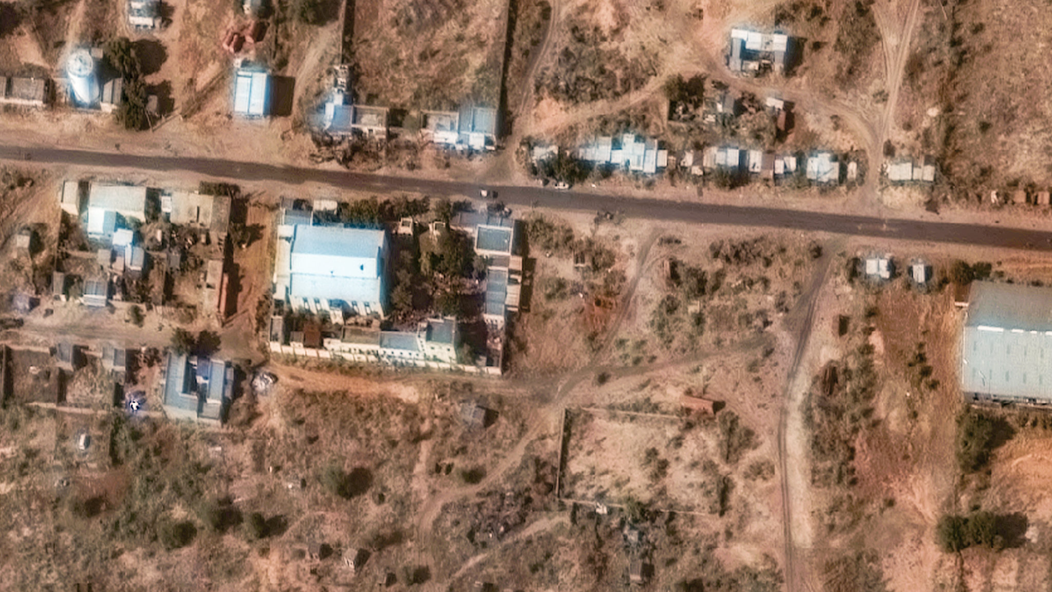 A satellite image from Vantor shows a trench suspected to be a mass grave near a former children's hospital in El Fasher, Sudan, held by the paramilitary Rapid Support Forces, November 2, 2025. /VCG
