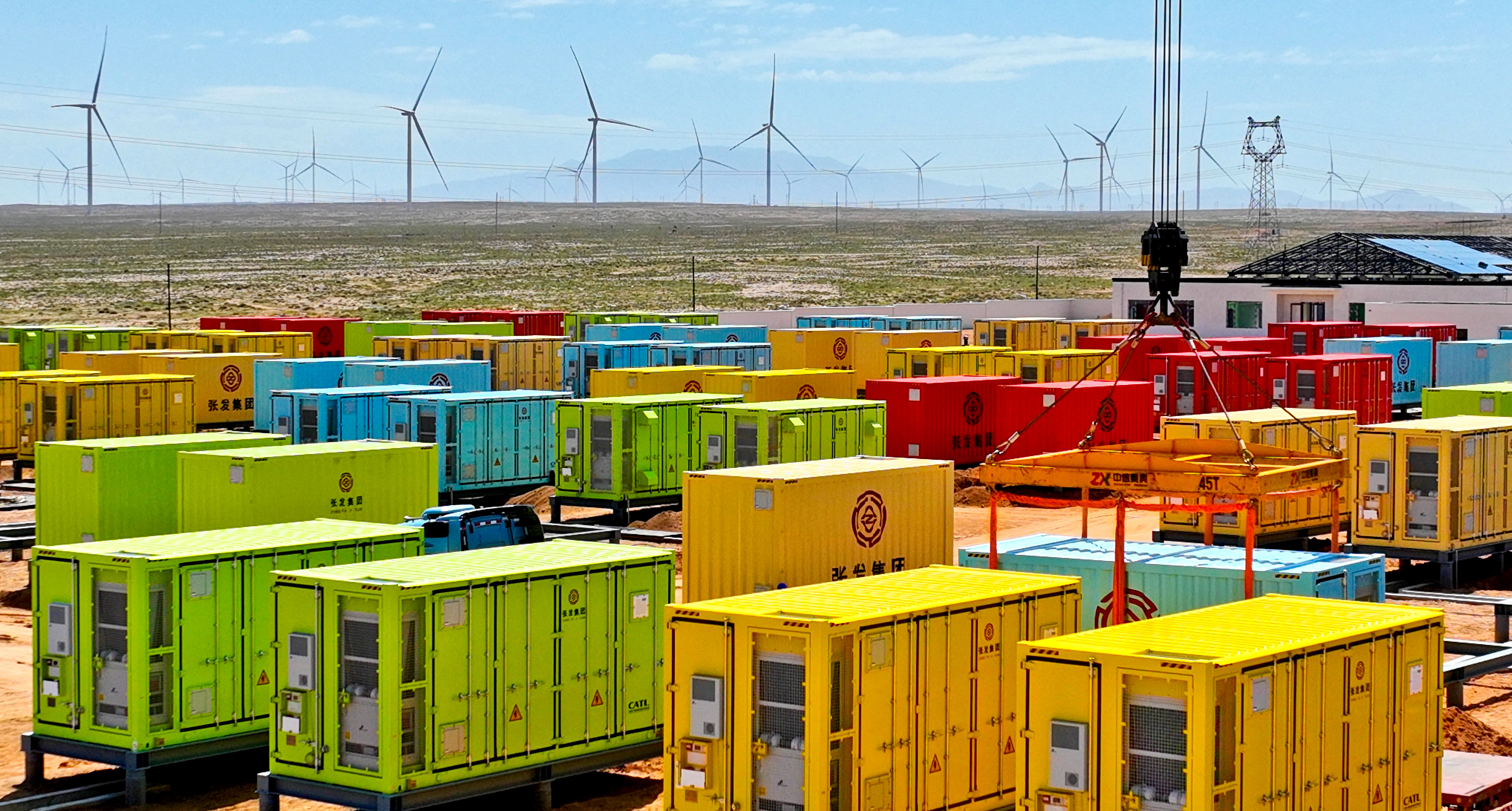An energy storage station operates alongside wind turbines, Zhangye city, northwest China's Gansu Province, August 12, 2025. /VCG