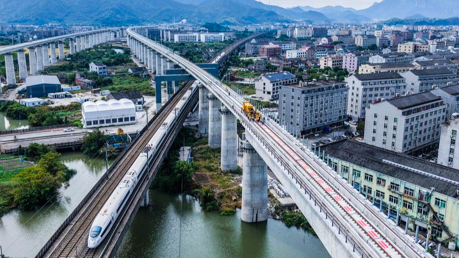 An aerial drone photo shows work going on to lay tracks for the Hangzhou-Taizhou high-speed railway in Taizhou, Zhejiang Province in east China, November 5, 2025. /Xinhua