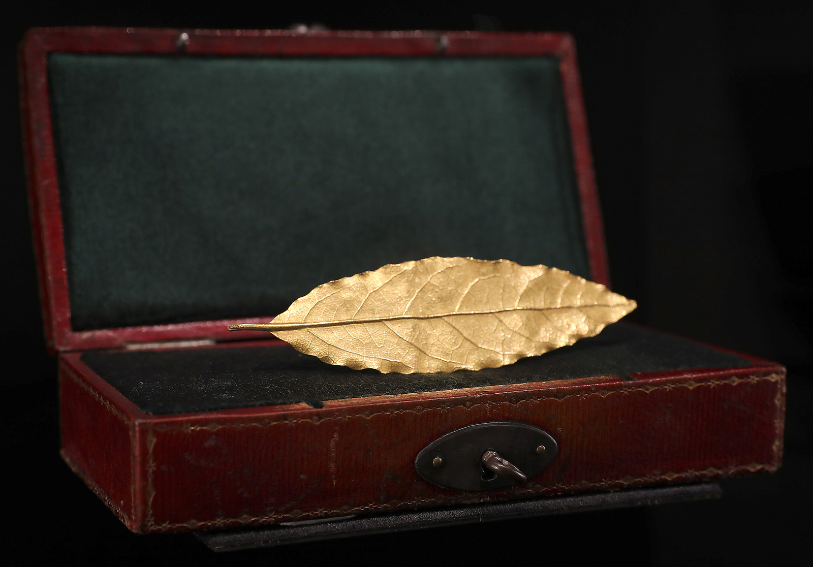 A gold leaf from the laurel crown worn by French Emperor Napoleon I at his coronation in 1804 is seen on display during the 8th China International Import Expo in Shanghai on November 8, 2025. /VCG