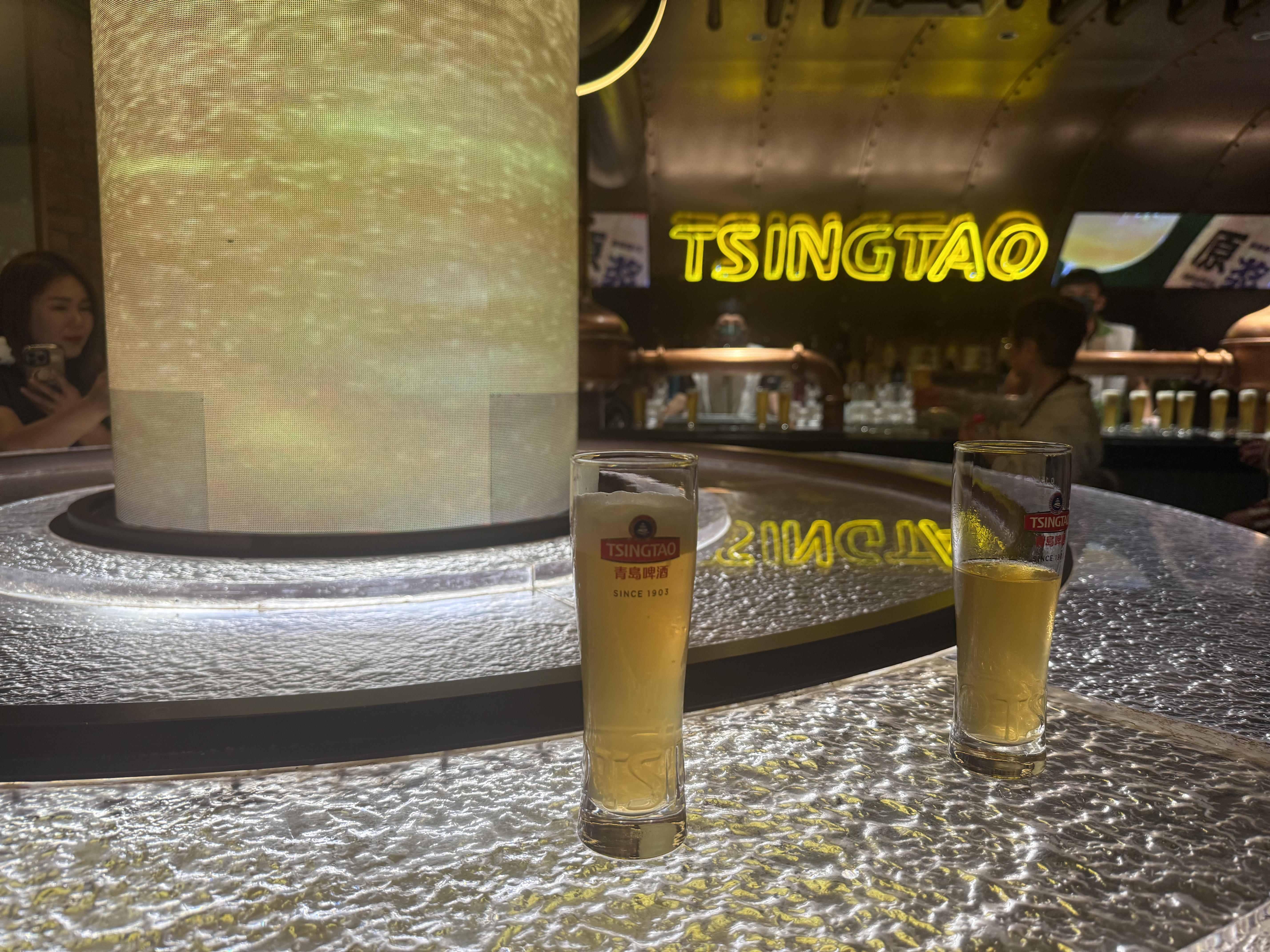 Beer glasses filled with freshly poured brews stand neatly on a polished countertop in the Tsingtao Beer Museum Tasting hall, Qingdao, September 2025, Zaruhi Poghosyan. /CGTN