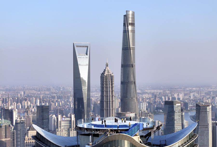 Visitors enjoying the cityscape at The Stage, a new observation deck atop White Magnolia Plaza in Shanghai, east China, April 14, 2025. /Xinhua