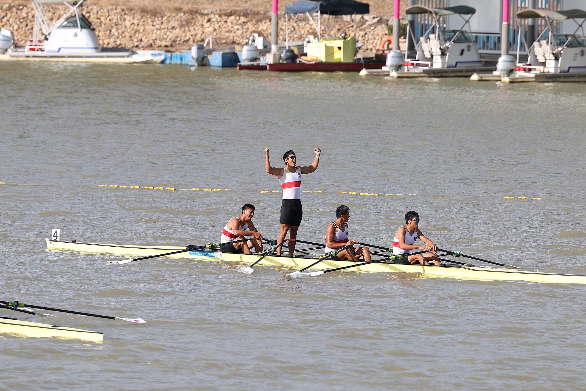 Jiangsu's rowers react after winning the men's quadruple sculls final at China's 15th National Games in Guangzhou, November 10, 2025. /VCG