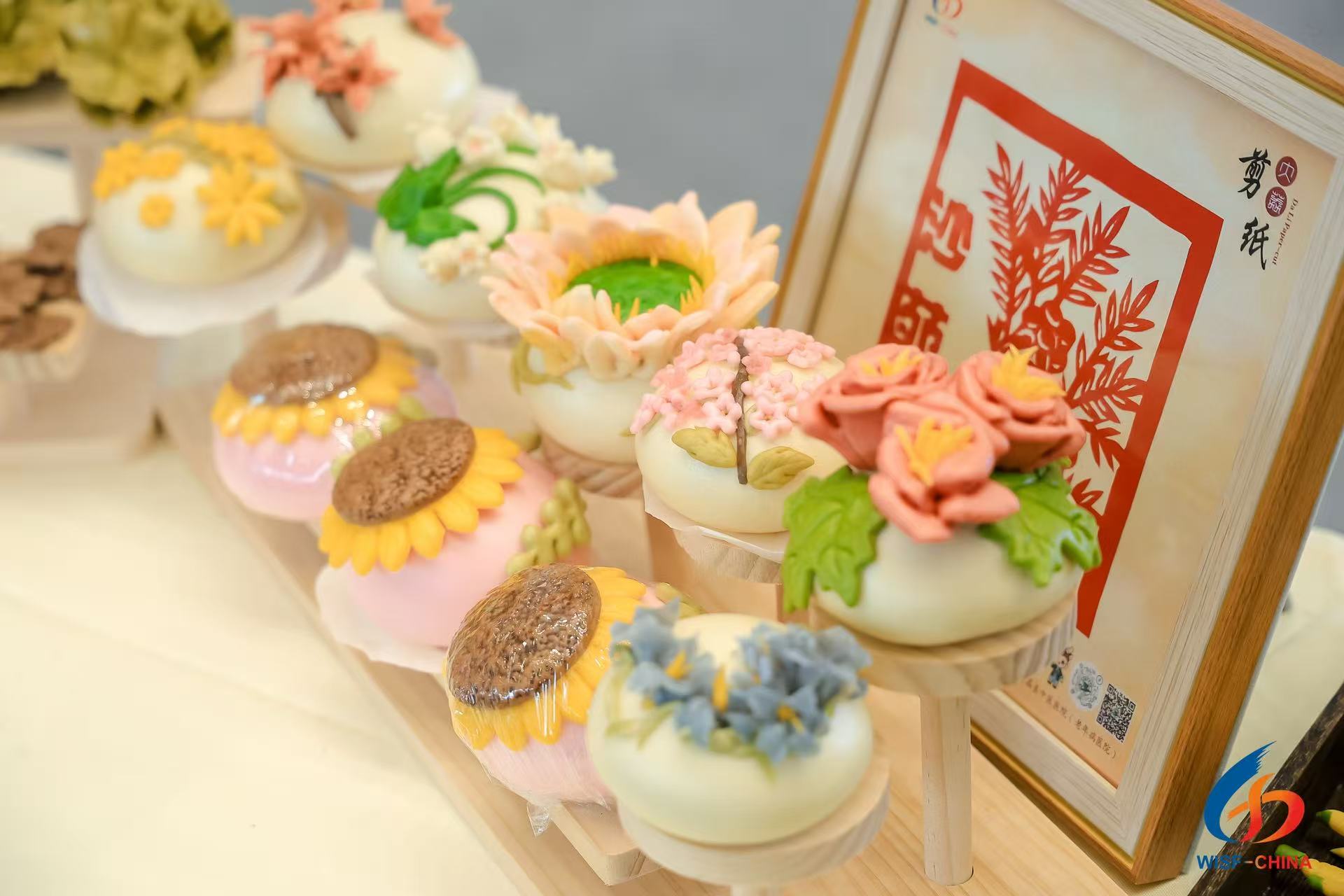 Medicinal herbal-infused decorative steamed buns are displayed at the 6th Western International Sourcing Exhibition in Xi'an in November 2025. /Photo provided to CGTN