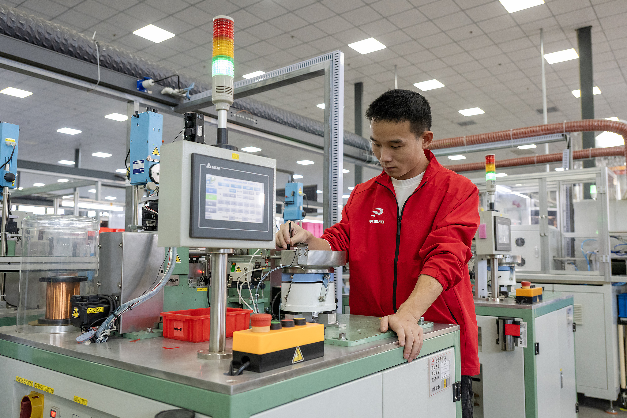 Workers manufacturing electronic components at a factory at Wuhu City, Anhui Province, November 13, 2025. /VCG