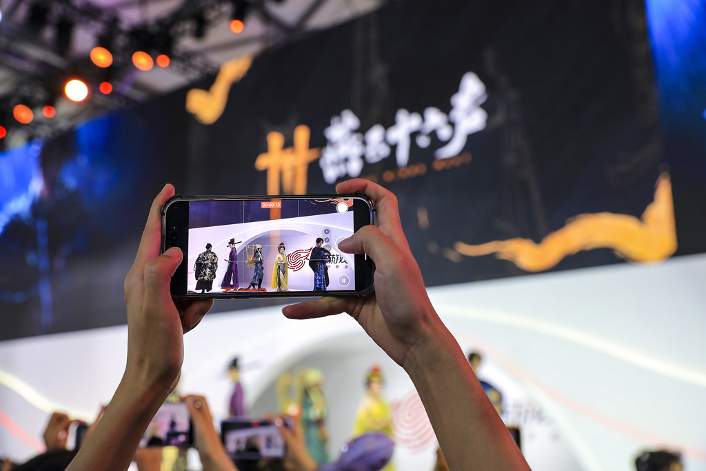 During China Joy in Shanghai, cosplayers at the booth of NetEase games 