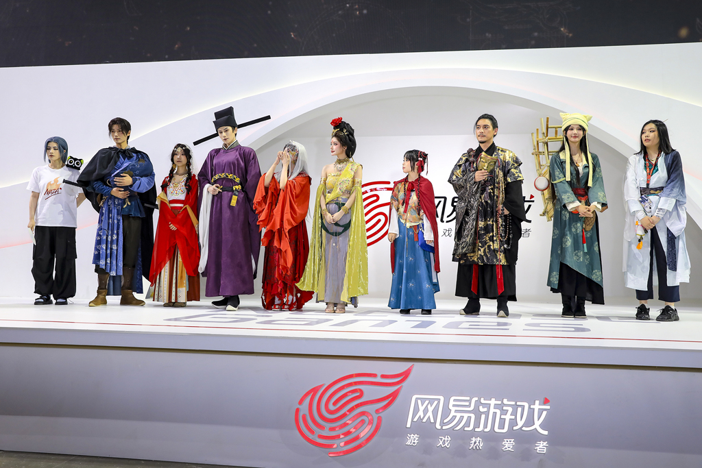 During China Joy in Shanghai, cosplayers at the booth of NetEase games 