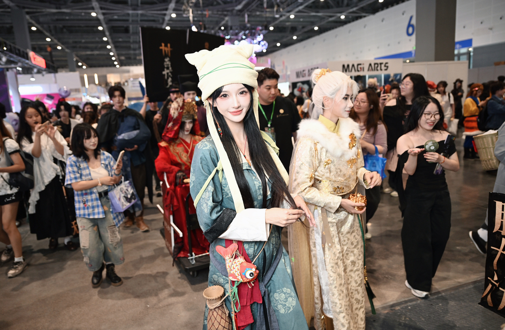 During China Joy in Shanghai, cosplayers at the booth of NetEase games 