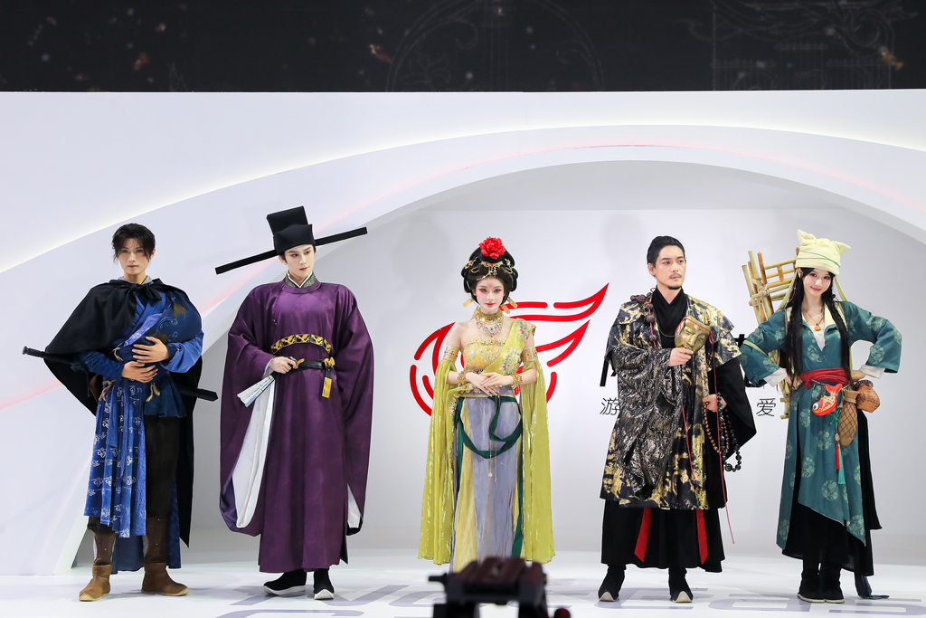 During China Joy in Shanghai, cosplayers at the booth of NetEase games 
