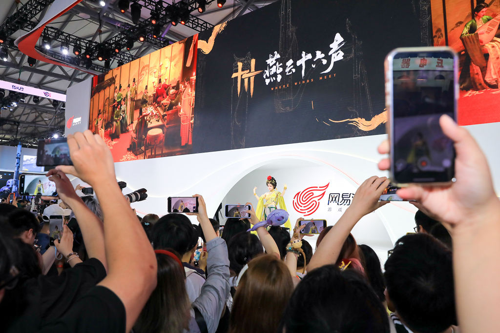 During China Joy in Shanghai, cosplayers at the booth of NetEase games 
