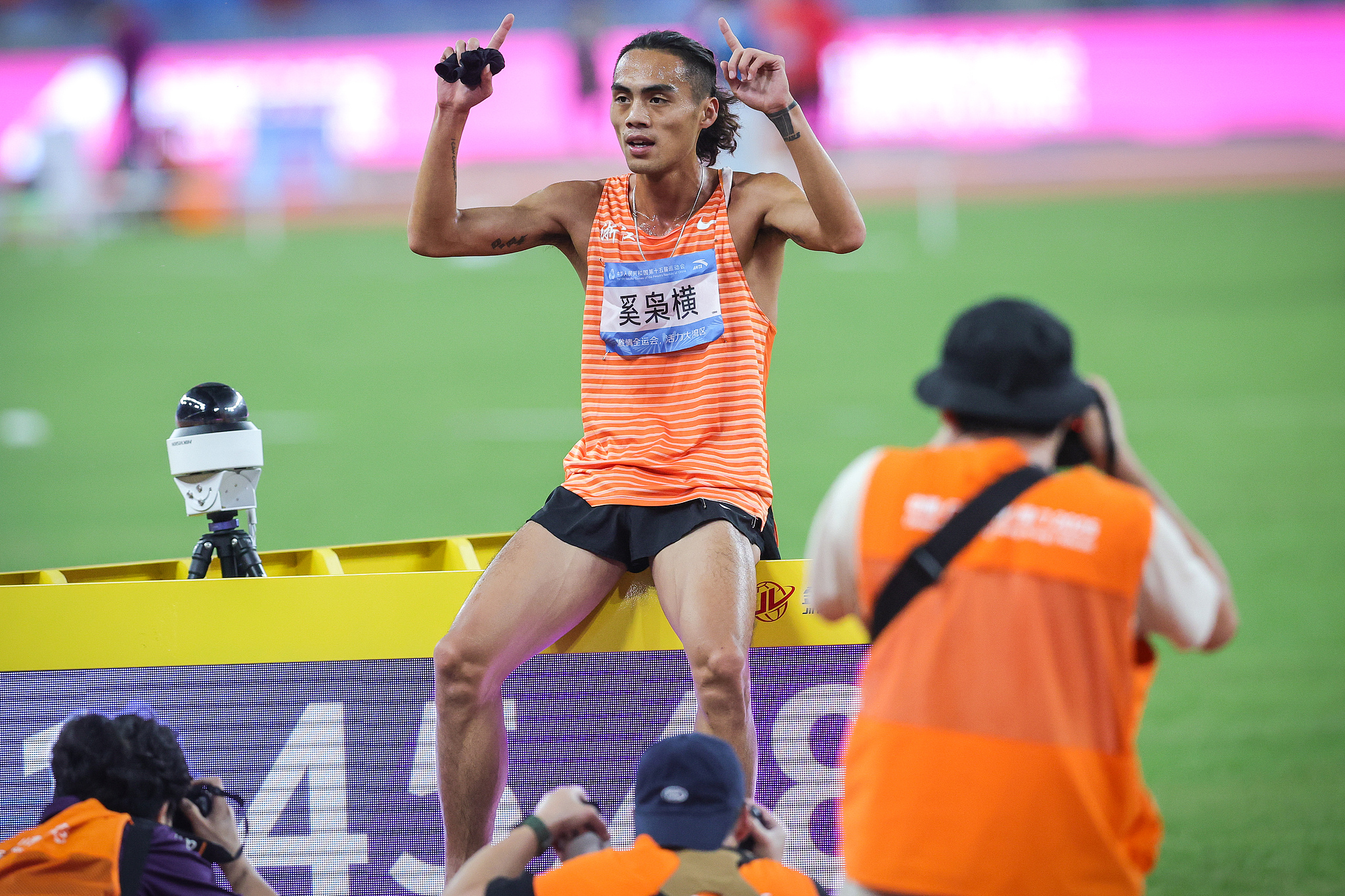 Zhejiang's Xi Xiaoheng celebrates after winning the men's 800 meter final at China's 15th National Games in Guangzhou, November 16, 2025. /VCG