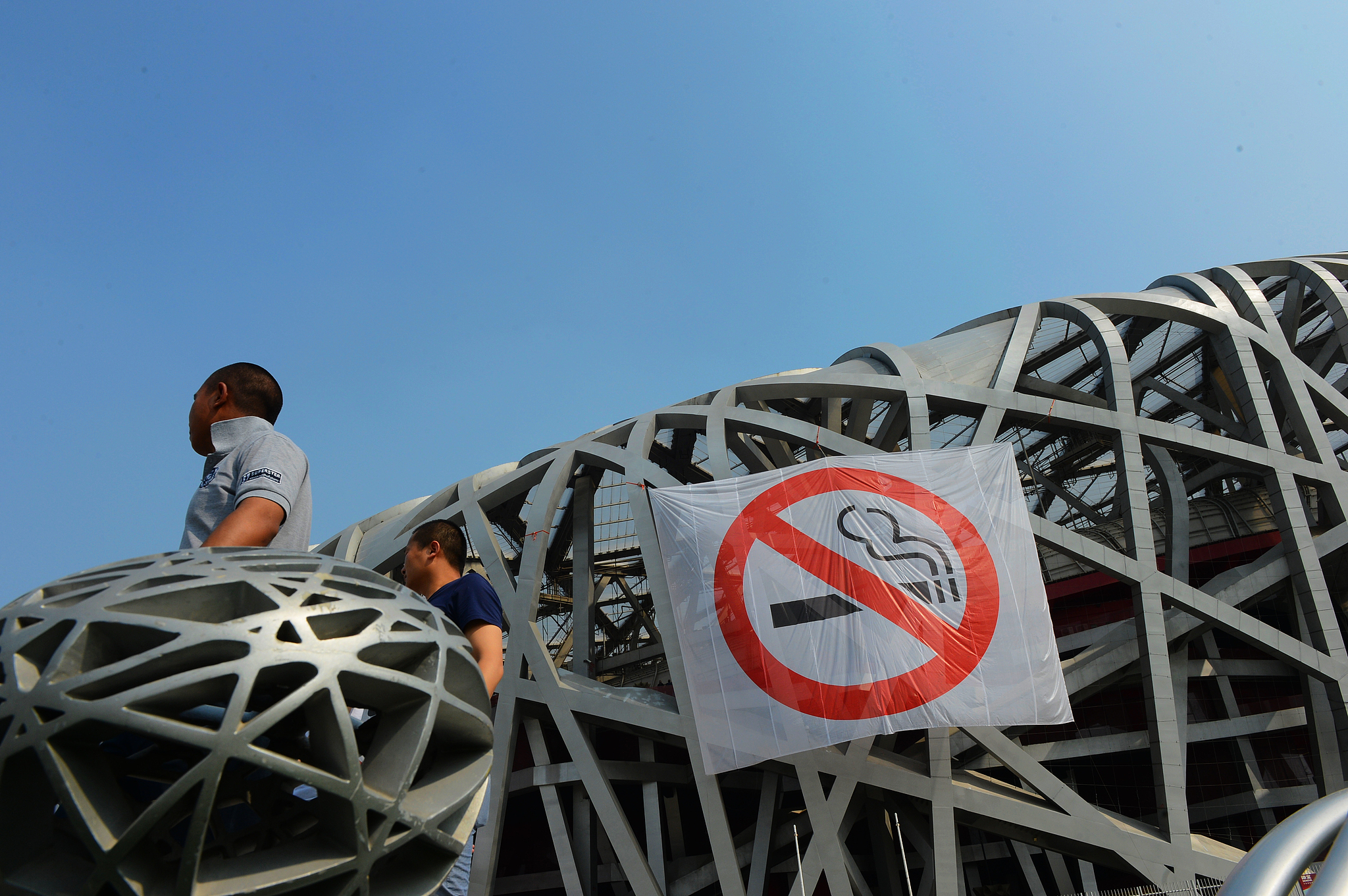 An anti-smoking banner is hung on Beijing's National Stadium, Beijing, China, May 30, 2015. /VCG