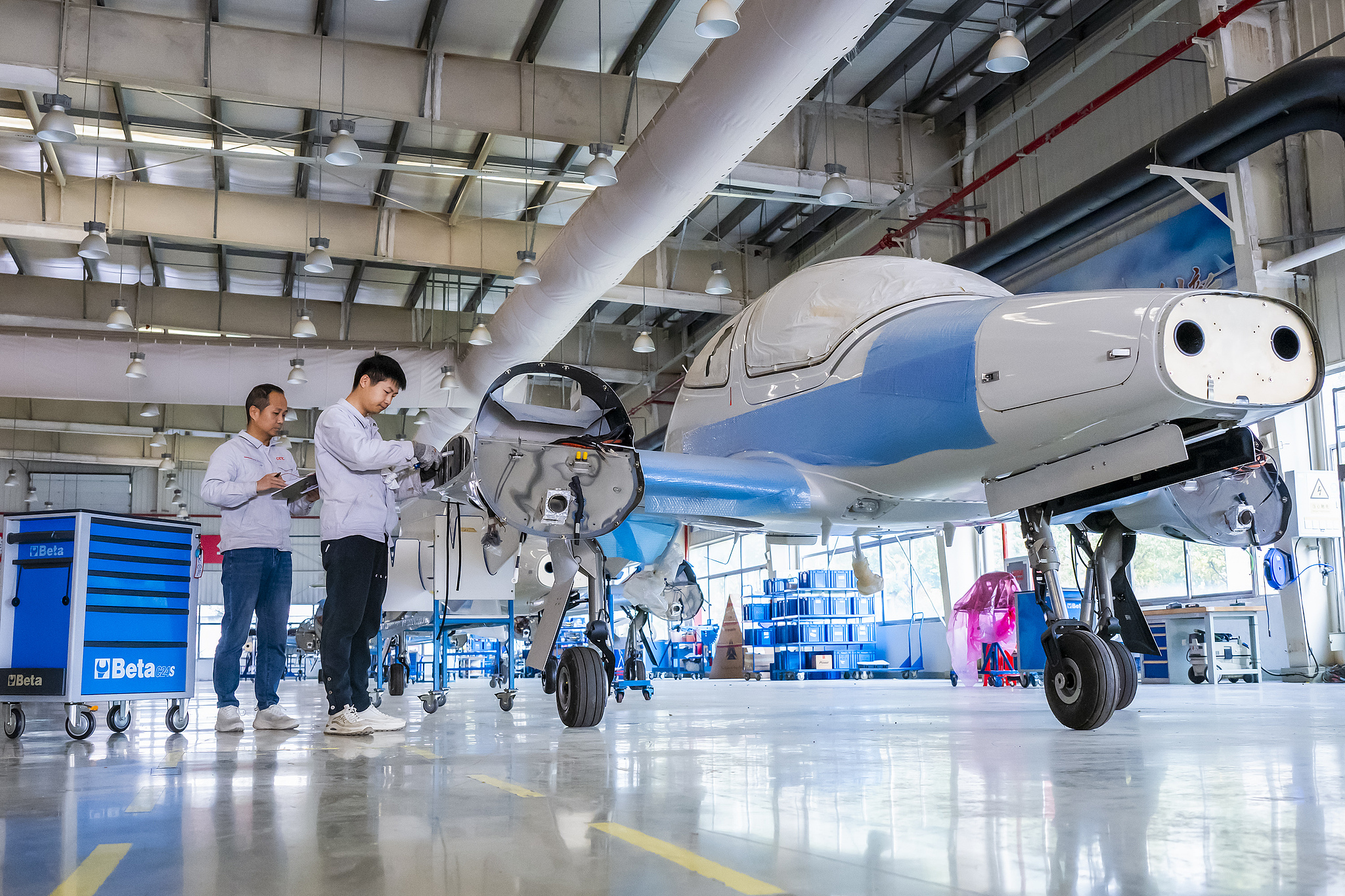 At an aircraft manufacturing company in Wuhu City, workers are seen operating in the aircraft manufacturing workshop, Anhui Province, China, November 14, 2025. /VCG